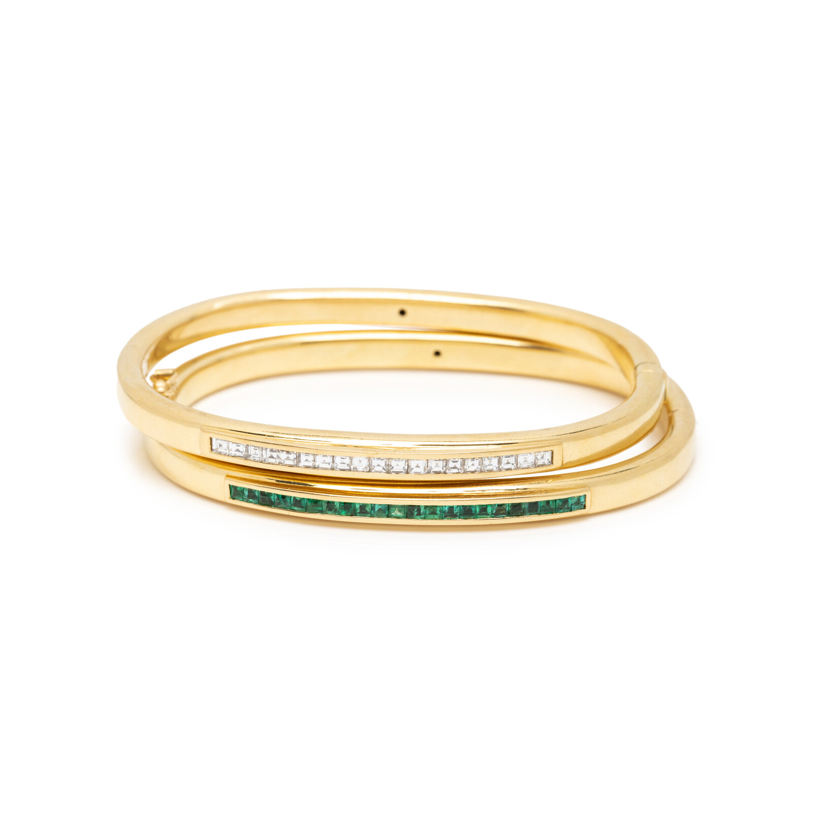 Appraisal: PAIR OF YELLOW GOLD AND GEMSTONE BANGLE BRACELETS One set