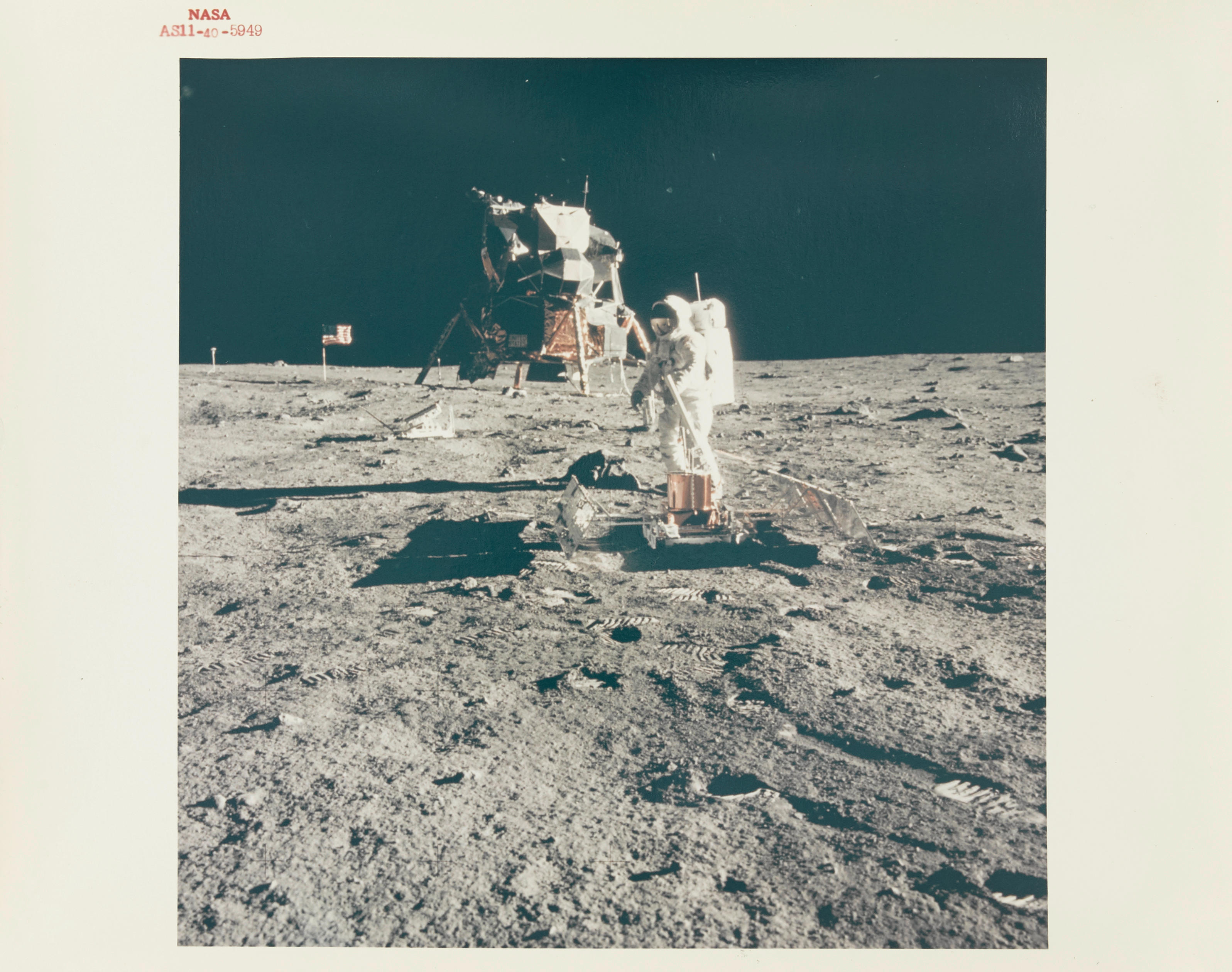 Appraisal: APOLLO NASA RED NUMBER PHOTOGRAPH ALDRIN DEPLOYS THE PSEP ON