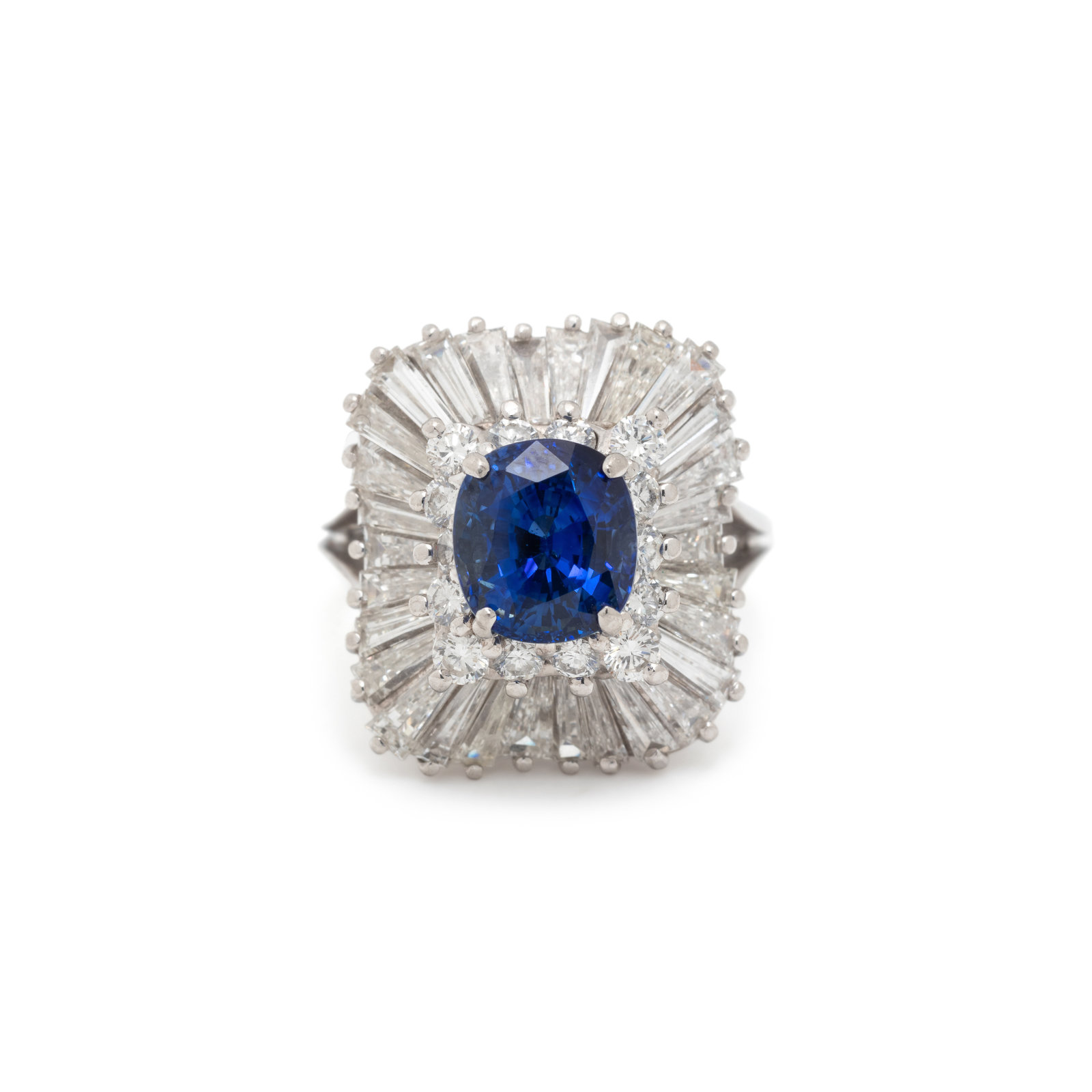 Appraisal: SAPPHIRE AND DIAMOND RING Containing one cushion cut sapphire measuring