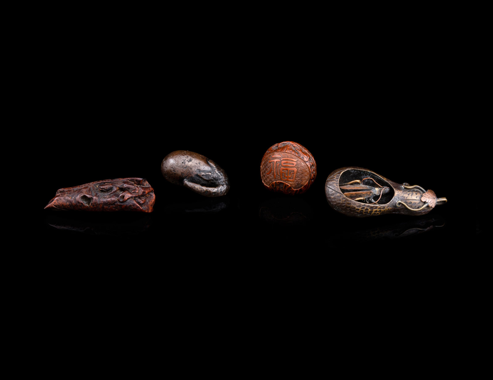 Appraisal: Four Japanese Netsuke th th Century comprising two bronze example