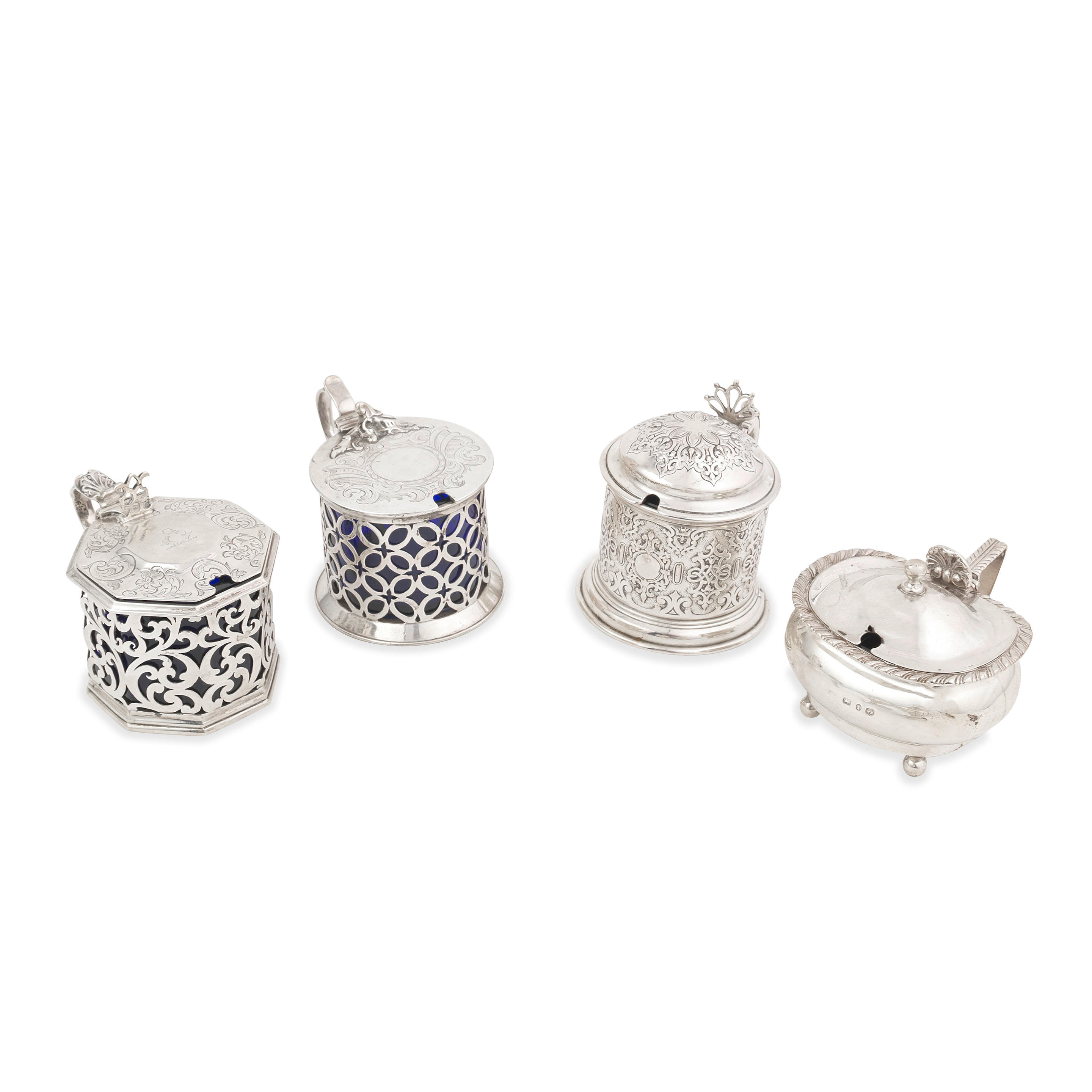 Appraisal: FOUR VICTORIAN SILVER MUSTARD POTS Comprising a mustard pot George