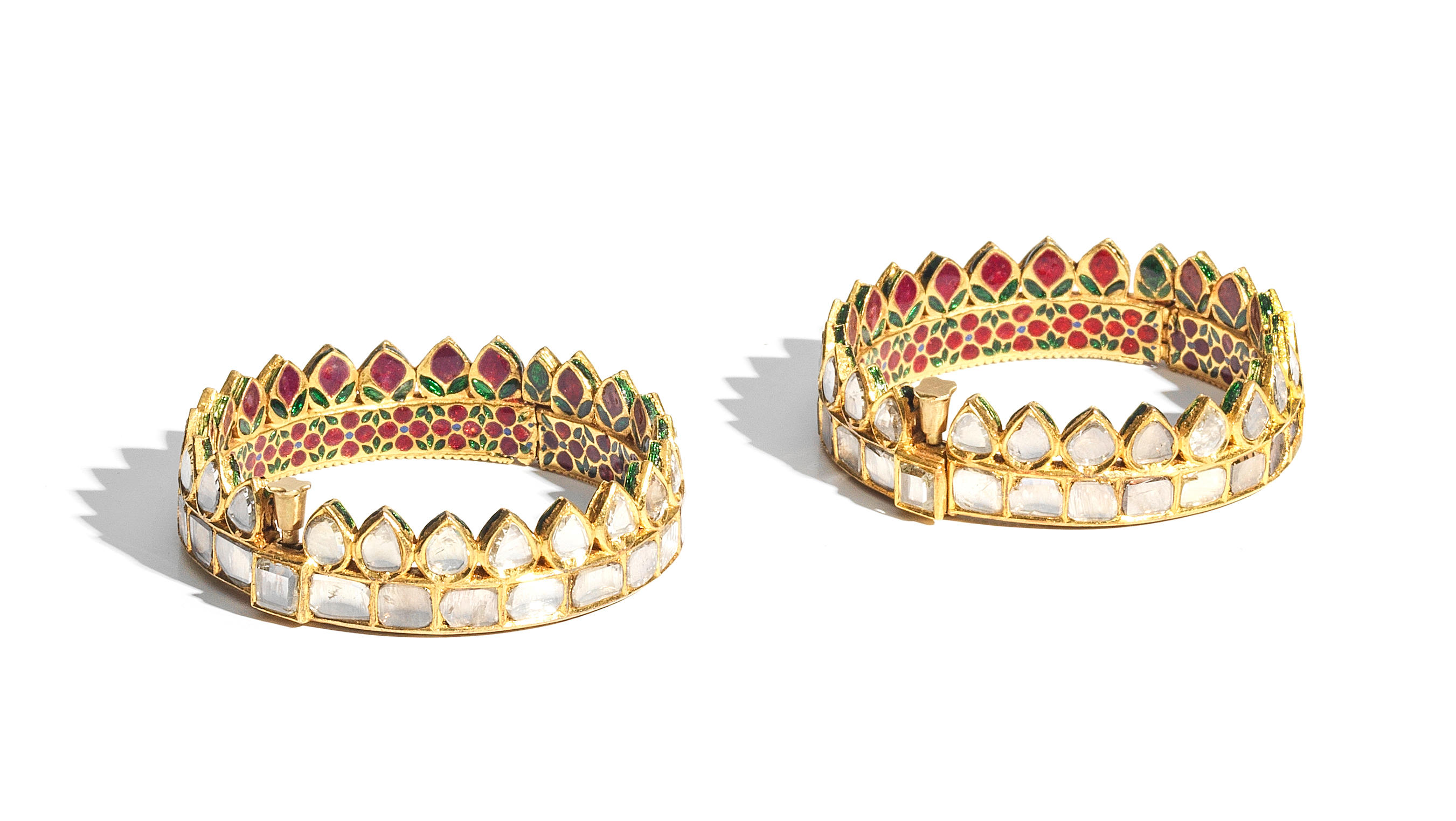 Appraisal: A PAIR OF DIAMOND-SET ENAMELLED GOLD BANGLES NORTH INDIA TH