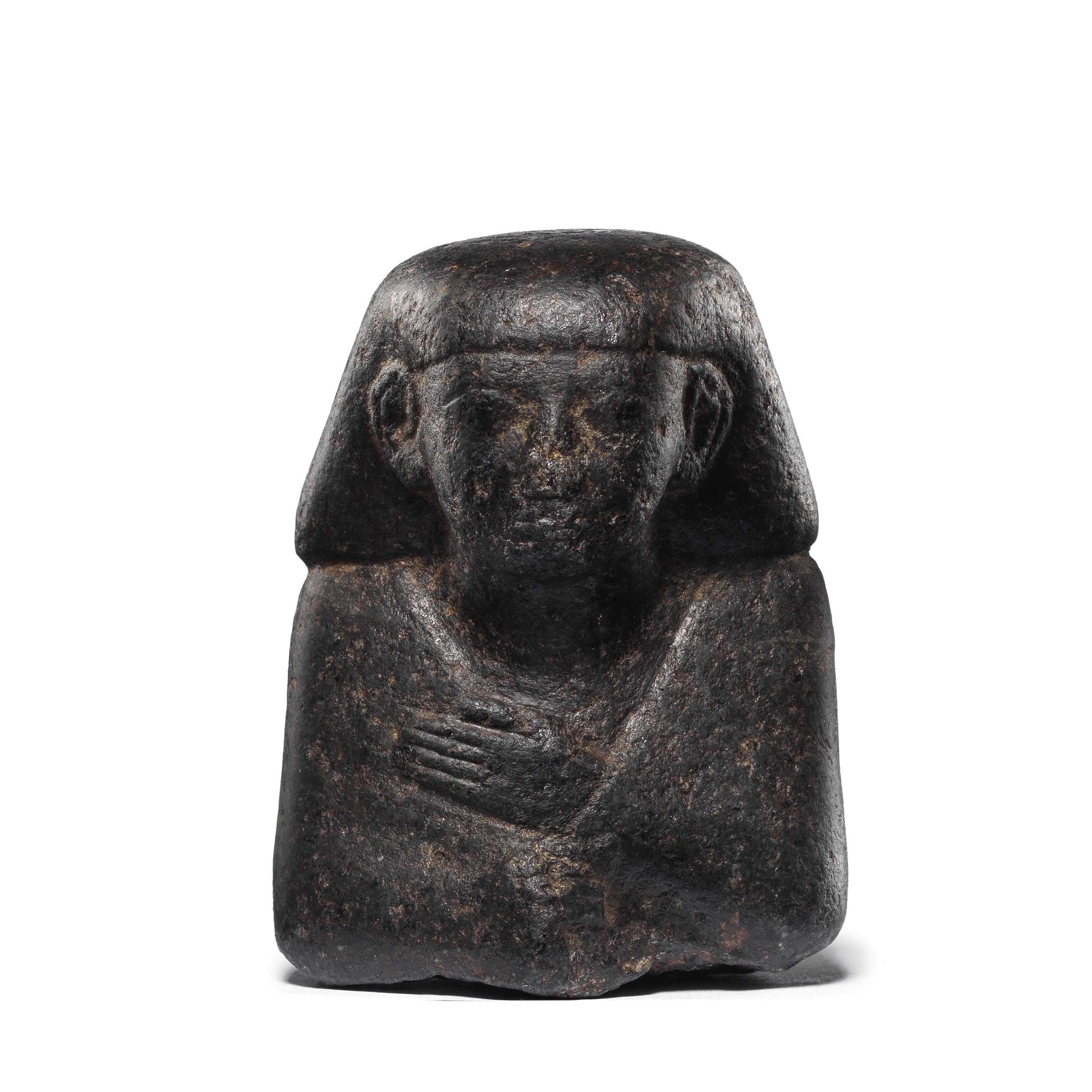 Appraisal: AN EGYPTIAN BASALT BUST OF AN OFFICIAL An Egyptian basalt