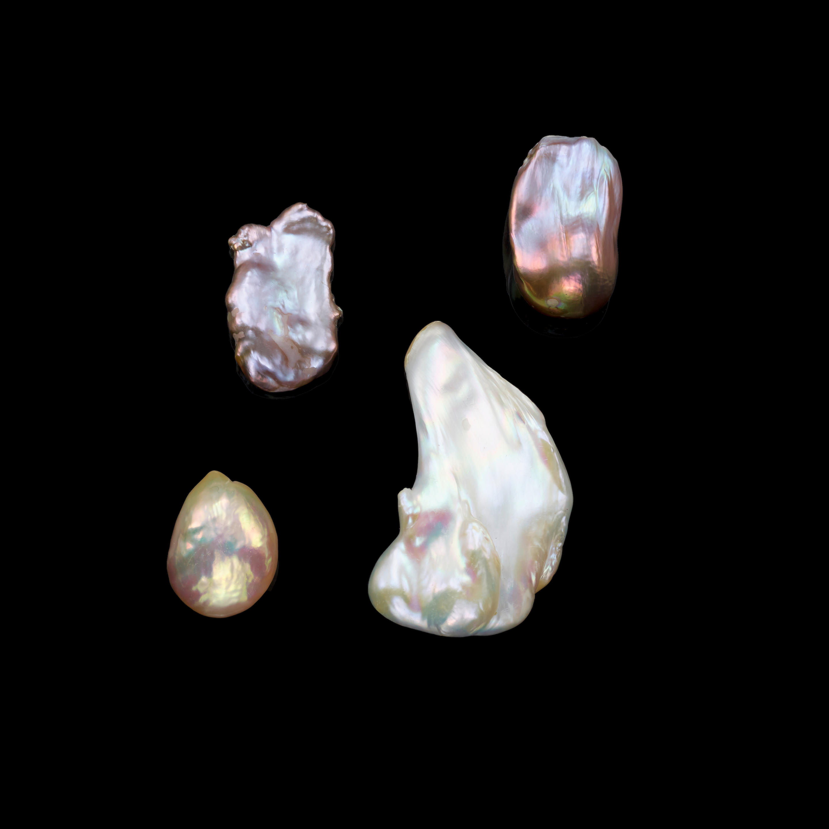 Appraisal: FOUR COLORFUL FRESHWATER BAROQUE CULTURED PEARLS China A large lustrous