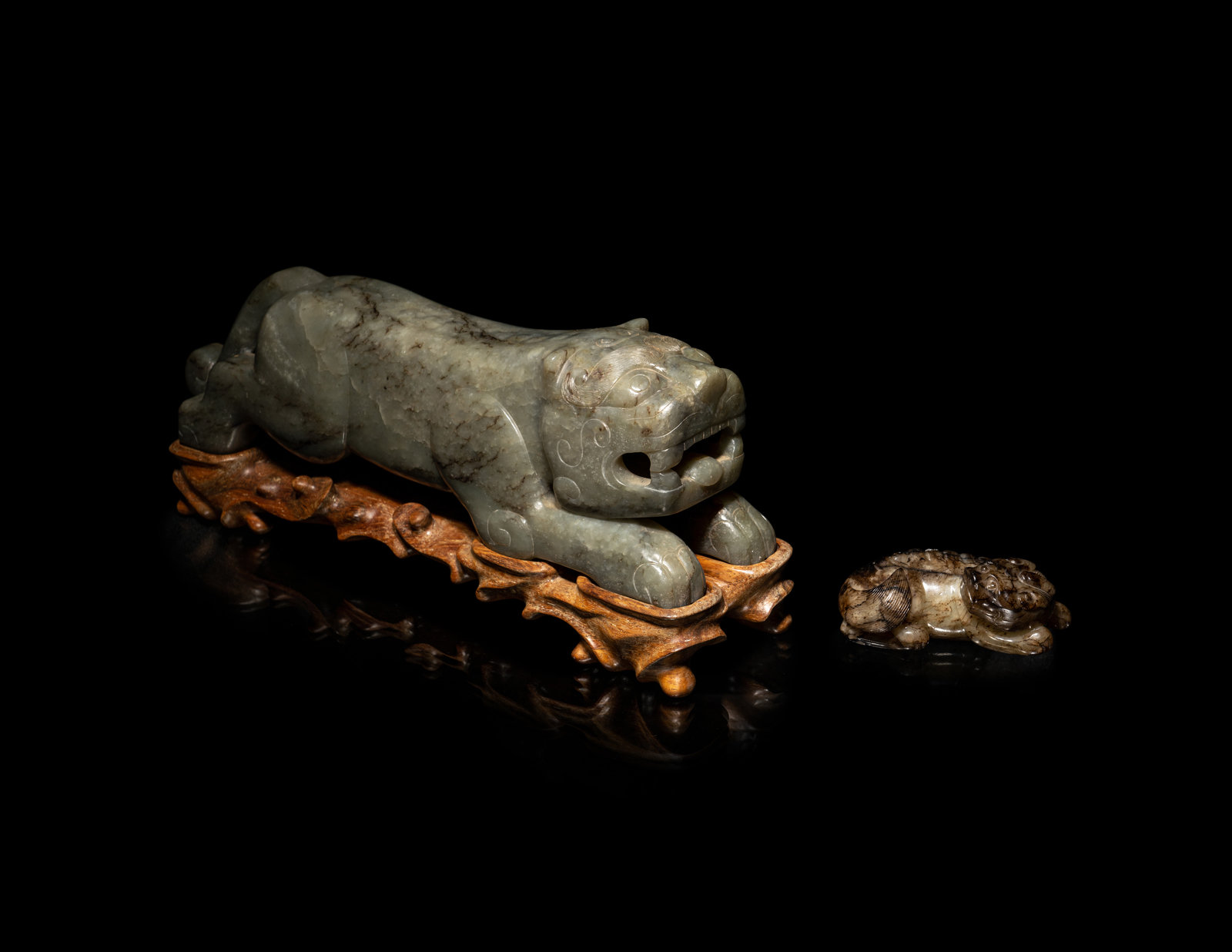 Appraisal: Two Chinese Mottled Jade Figures of Beasts Ming-Qing Dynasty -