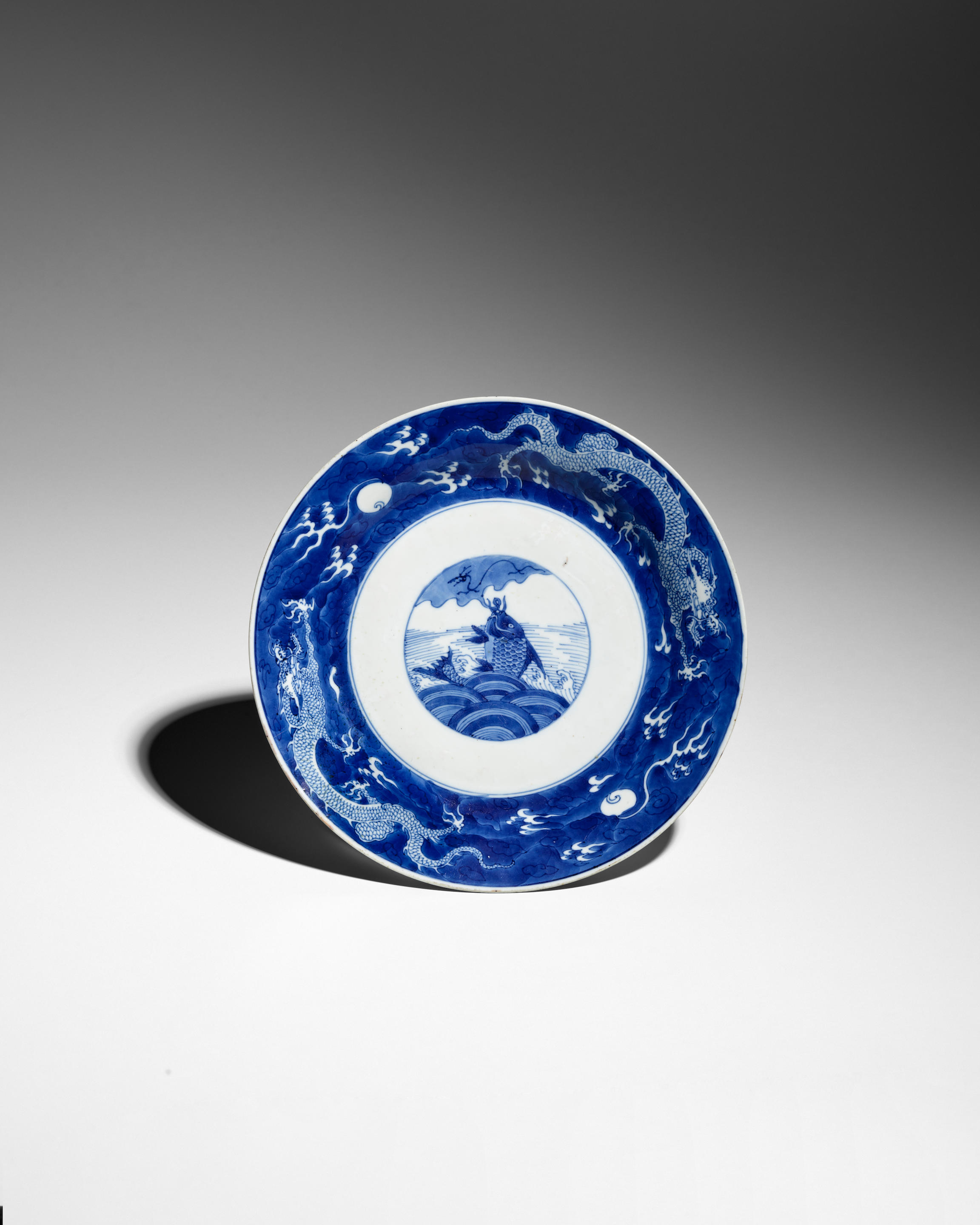 Appraisal: A BLUE AND WHITE 'CARP AND DRAGONS' DISH Chenghua mark