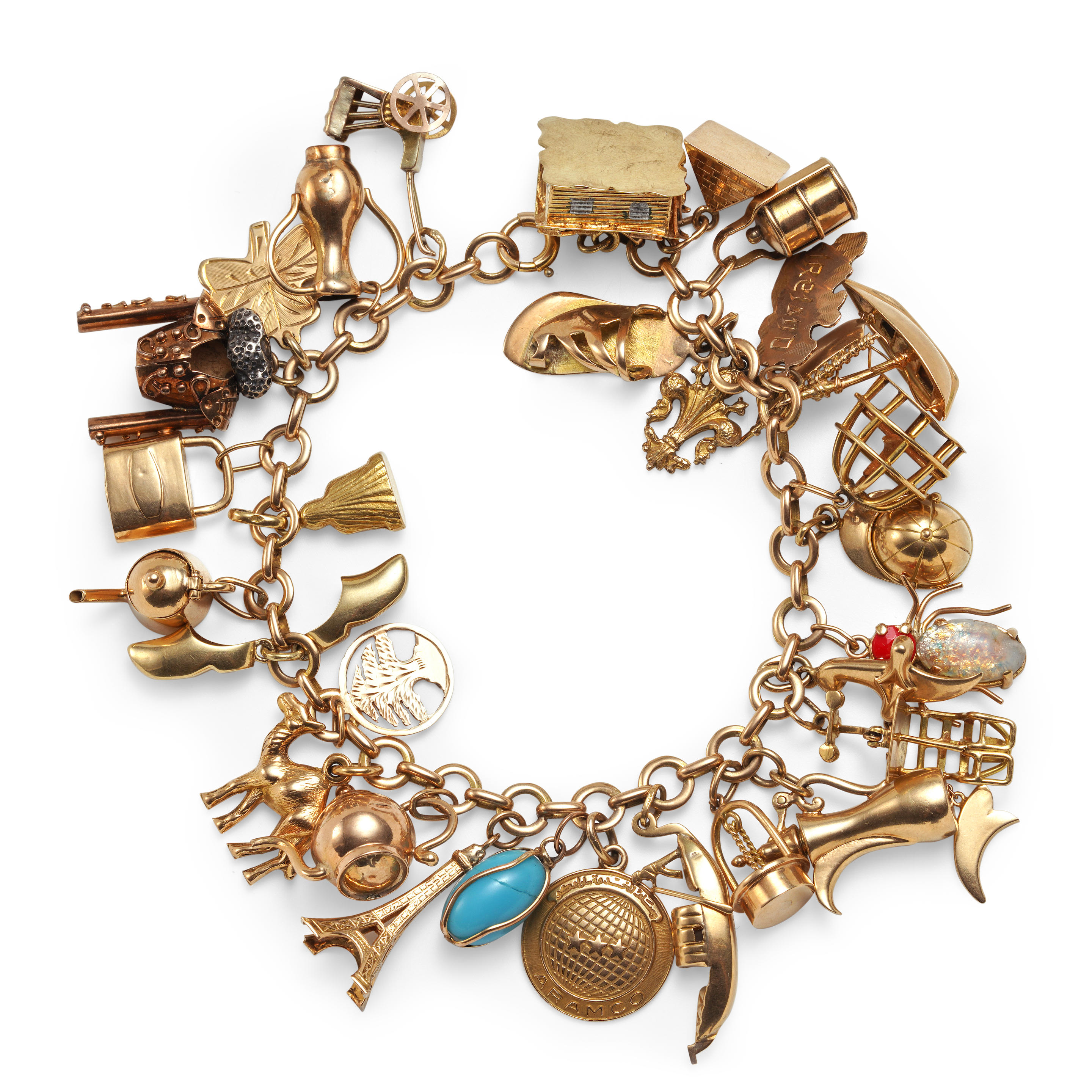 Appraisal: A GOLD CHARM BRACELET The k gold bracelet suspending mostly