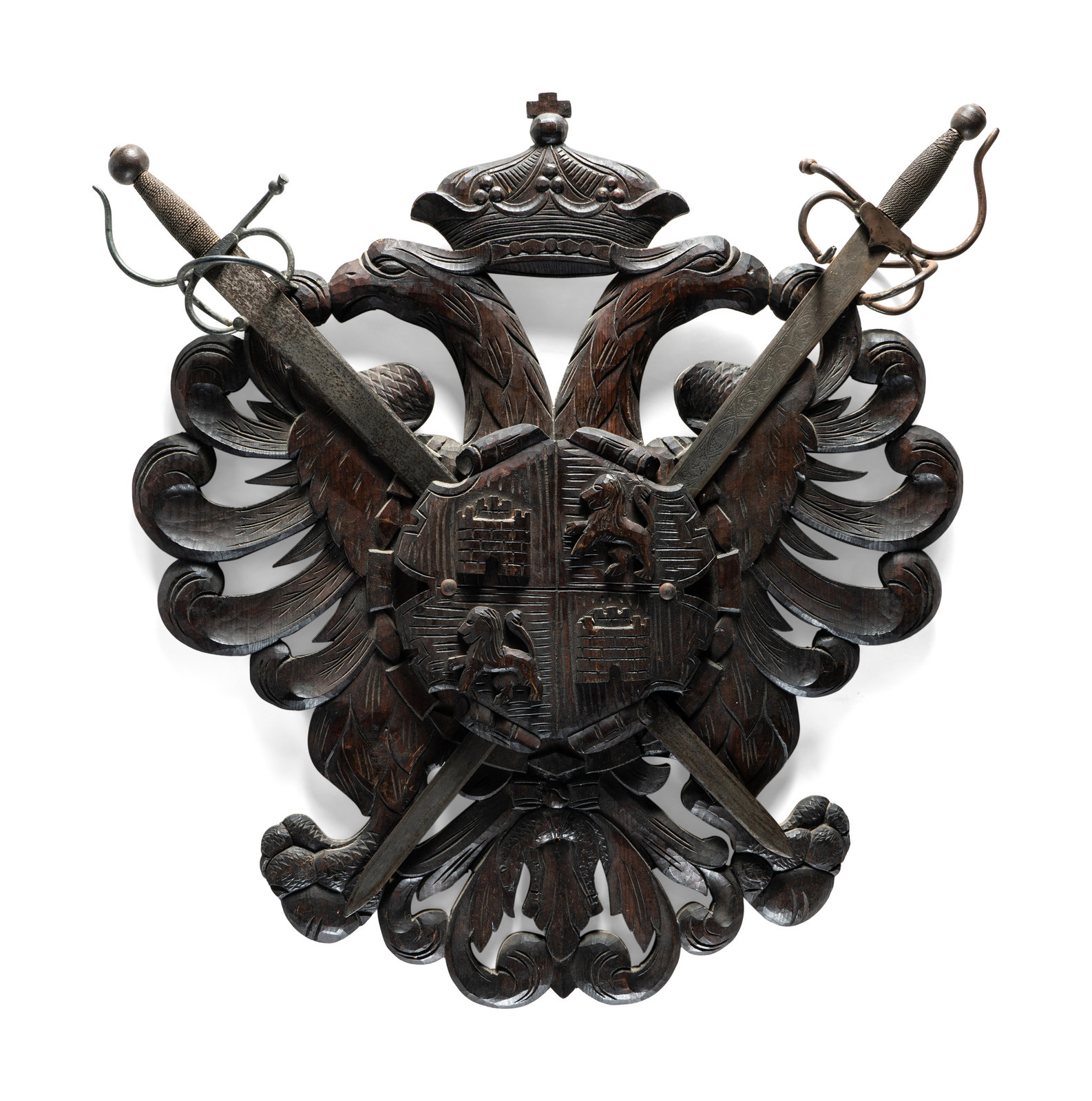 Appraisal: A Continental Carved Walnut Coat-of-Arms Plaque with Metal Crossed Swords