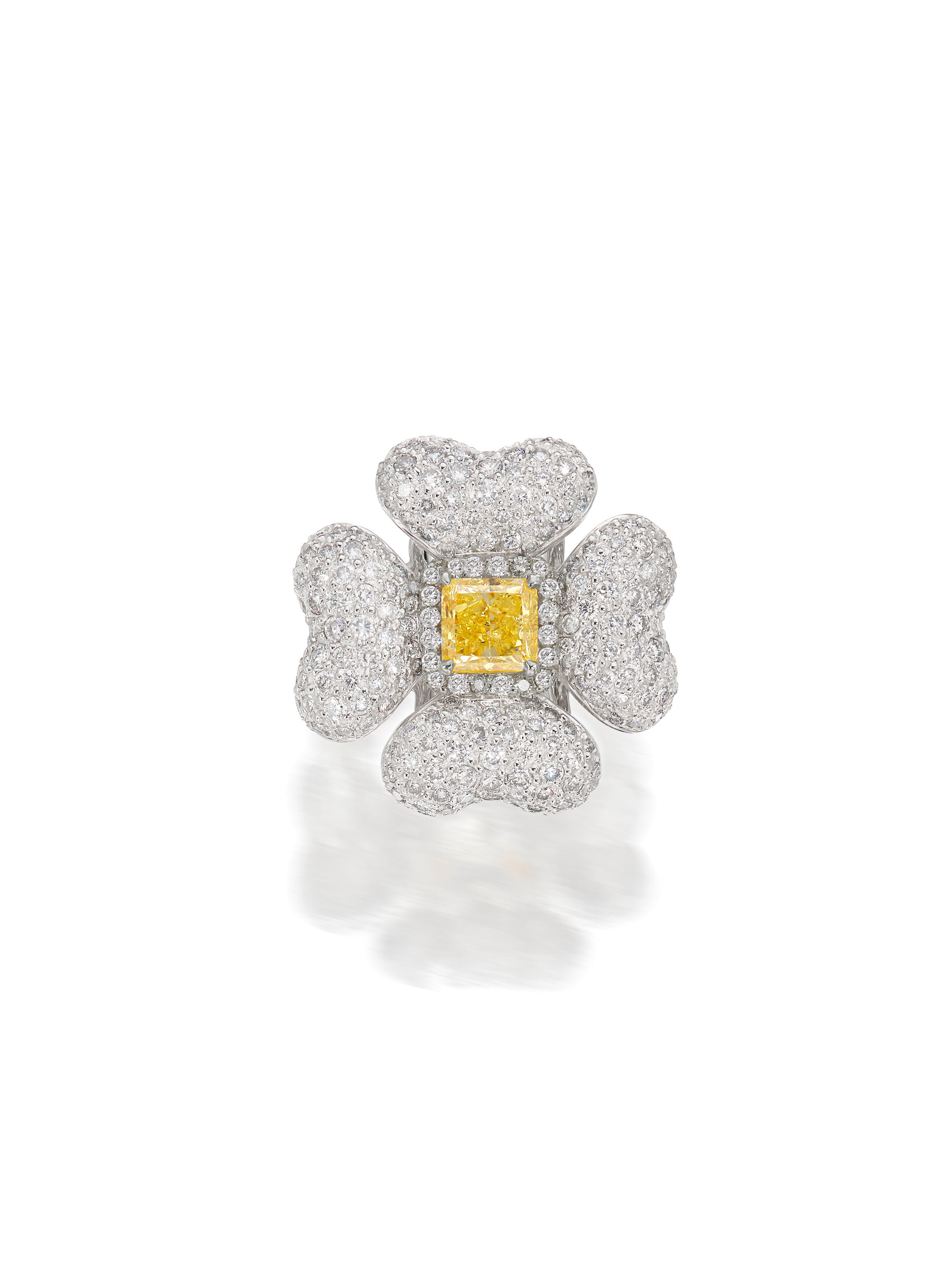 Appraisal: A COLOURED DIAMOND AND DIAMOND FLOWER RING Set with a