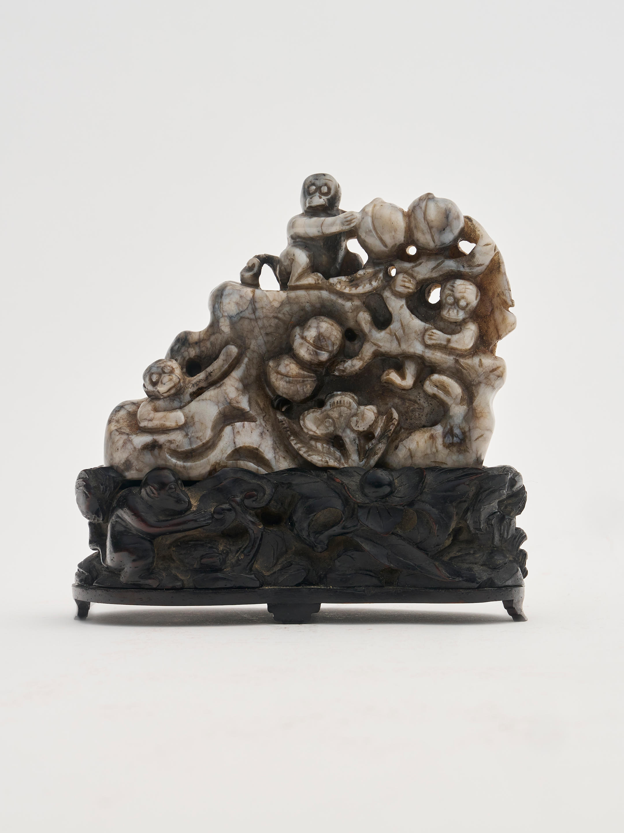 Appraisal: A BLACK AND WHITE JADE 'MONKEY' BOULDER th th century