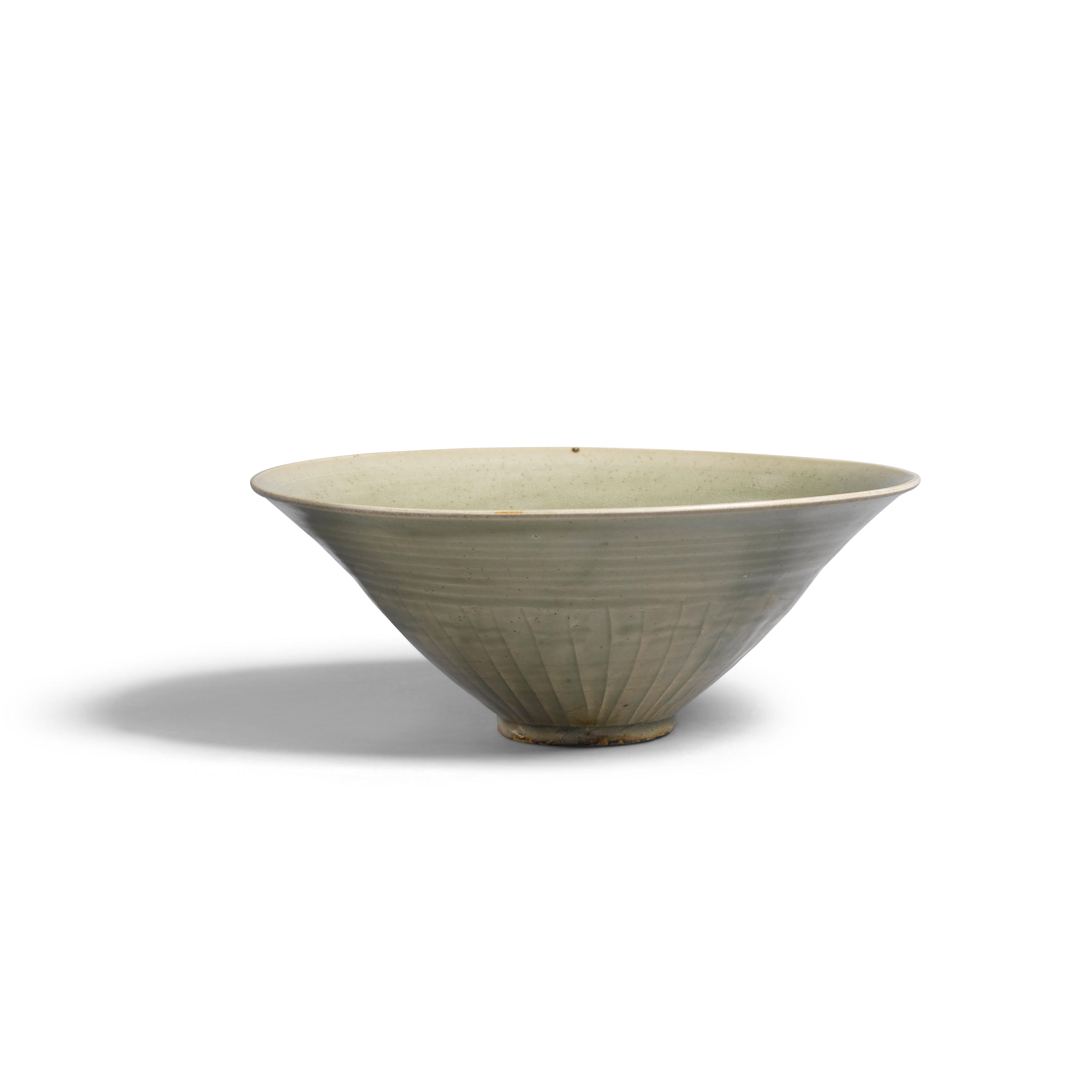 Appraisal: A YAOZHOU CELADON-GLAZED CONICAL BOWL Song dynasty The deep sides