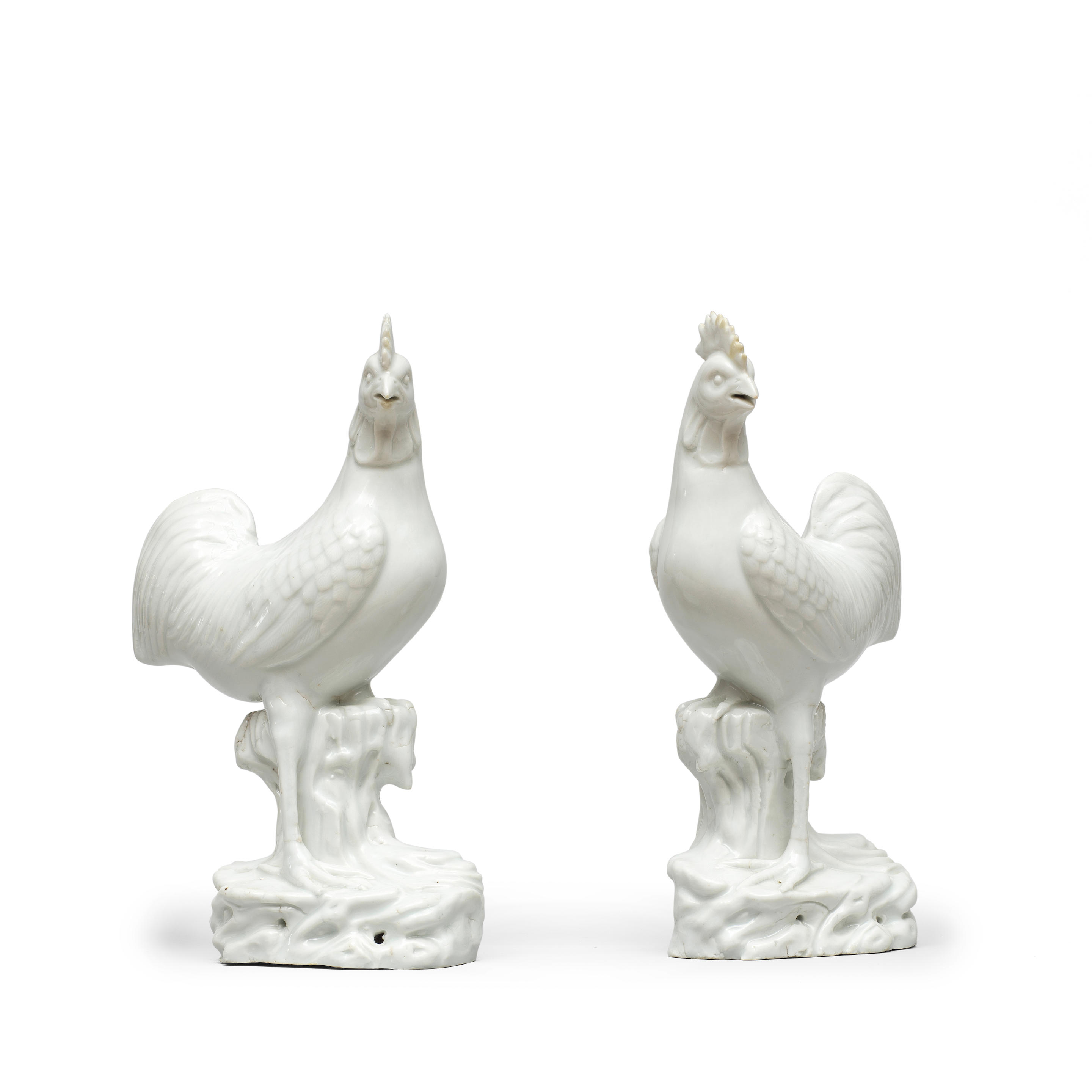 Appraisal: A PAIR OF BLANC-DE-CHINE COCKERELS th th century Each standing