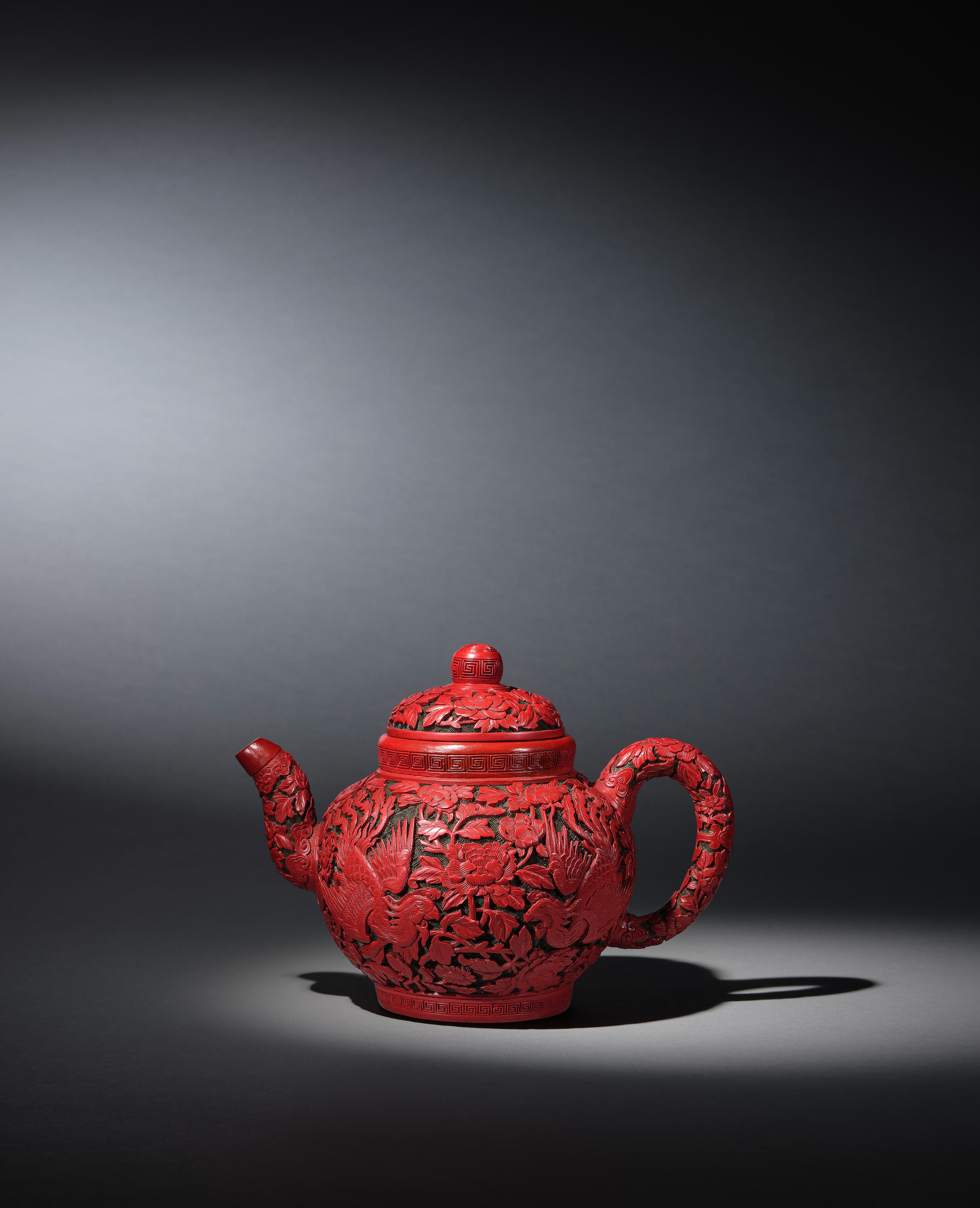 Appraisal: A VERY RARE IMPERIAL TWO-COLOUR CINNABAR-LACQUERED YIXING TEAPOT AND COVER