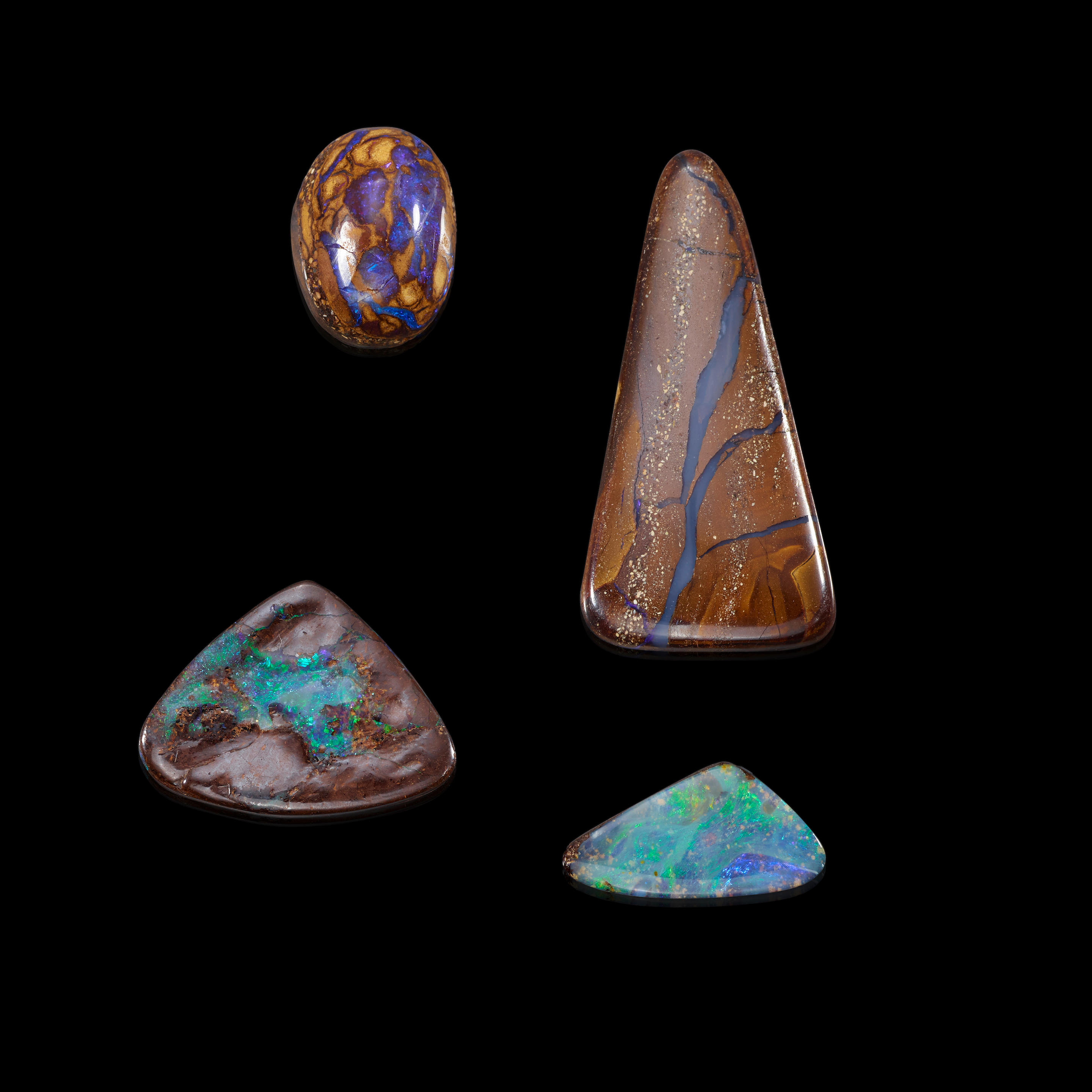 Appraisal: FOUR BOULDER OPALS Queensland Australia Comprising four boulder opal cabochons