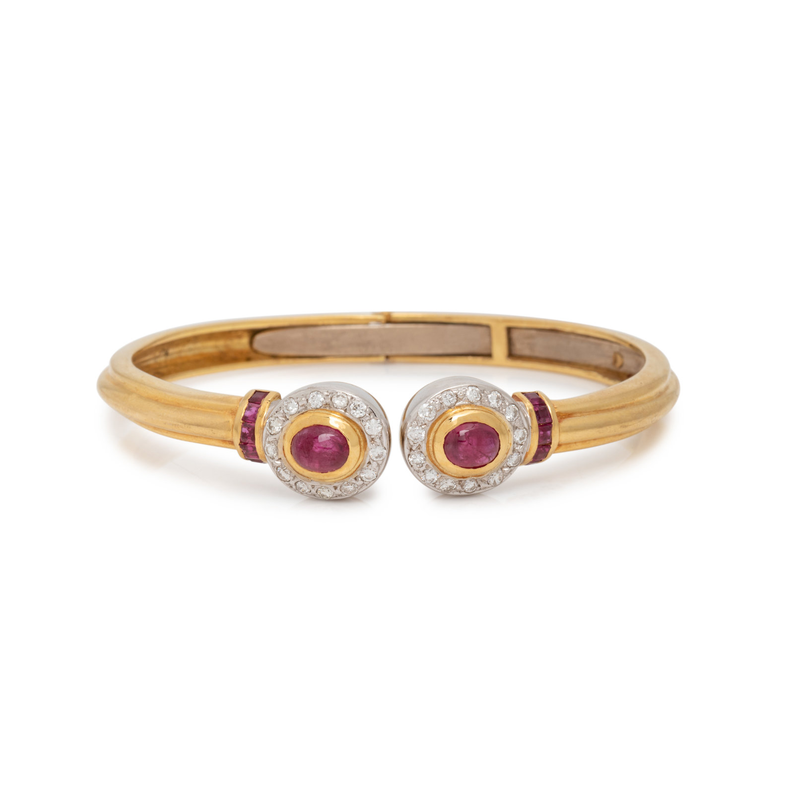 Appraisal: BICOLOR GOLD RUBY AND DIAMOND CUFF BRACELET Containing two oval