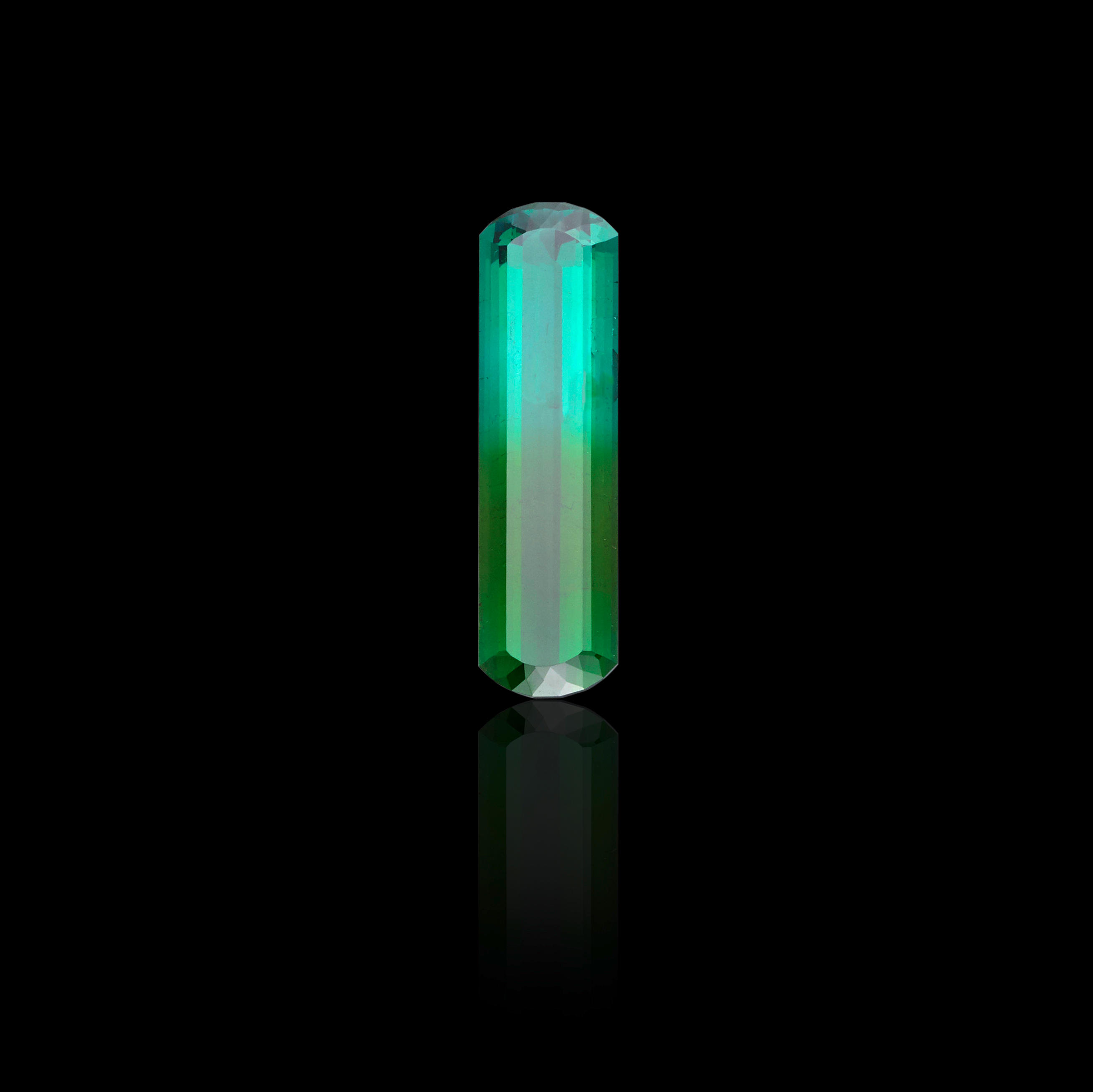 Appraisal: EXCEPTIONAL BI-COLOR BLUE-GREEN TOURMALINE Brazil An elongated rectangular cut with