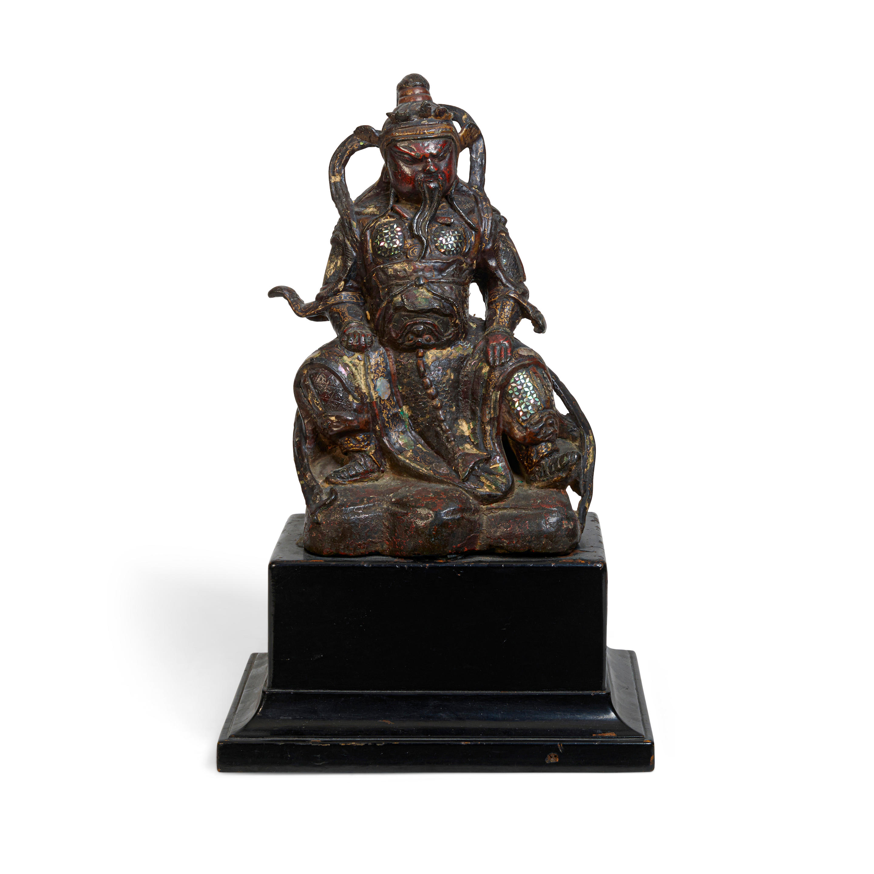 Appraisal: A JAPANESE SHELL-INLAID PAINTED BRONZE FIGURE OF A SEATED GUARDIAN