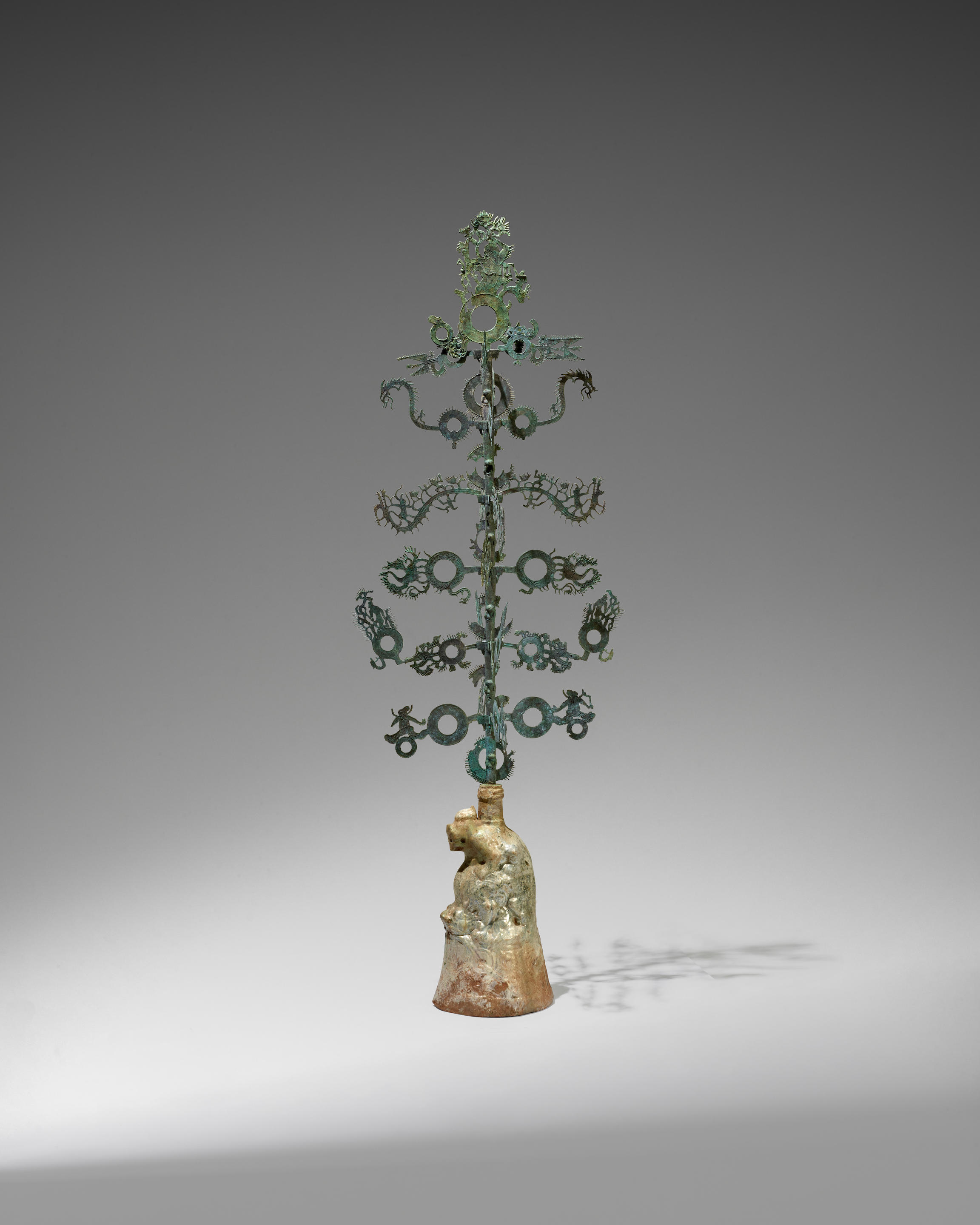 Appraisal: A LARGE BRONZE 'MONEY TREE' WITH GREEN-GLAZED RED POTTERY BASE