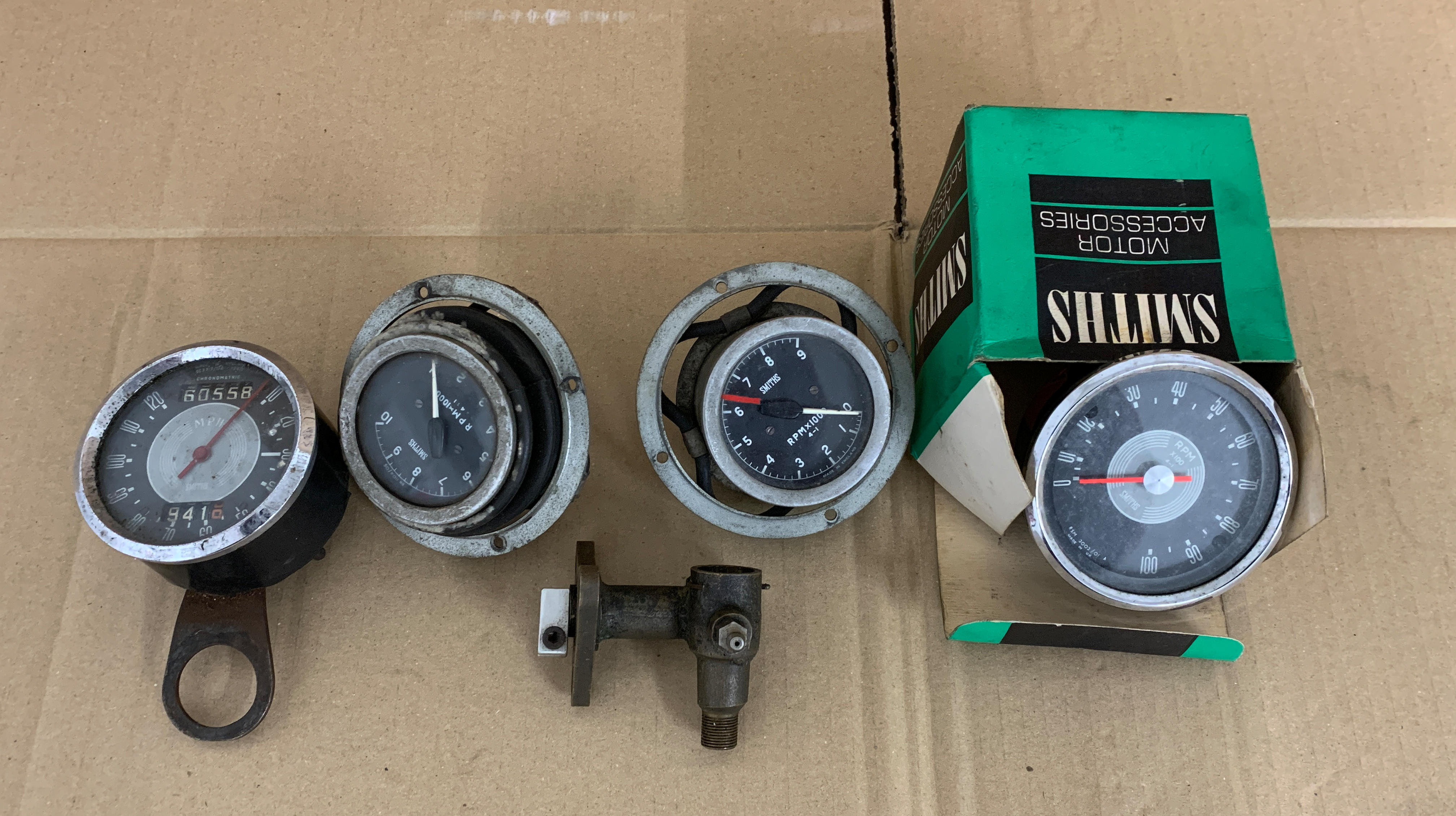 Appraisal: THREE SMITHS TACHOMETERS together with a Smiths chronometric mph speedometer