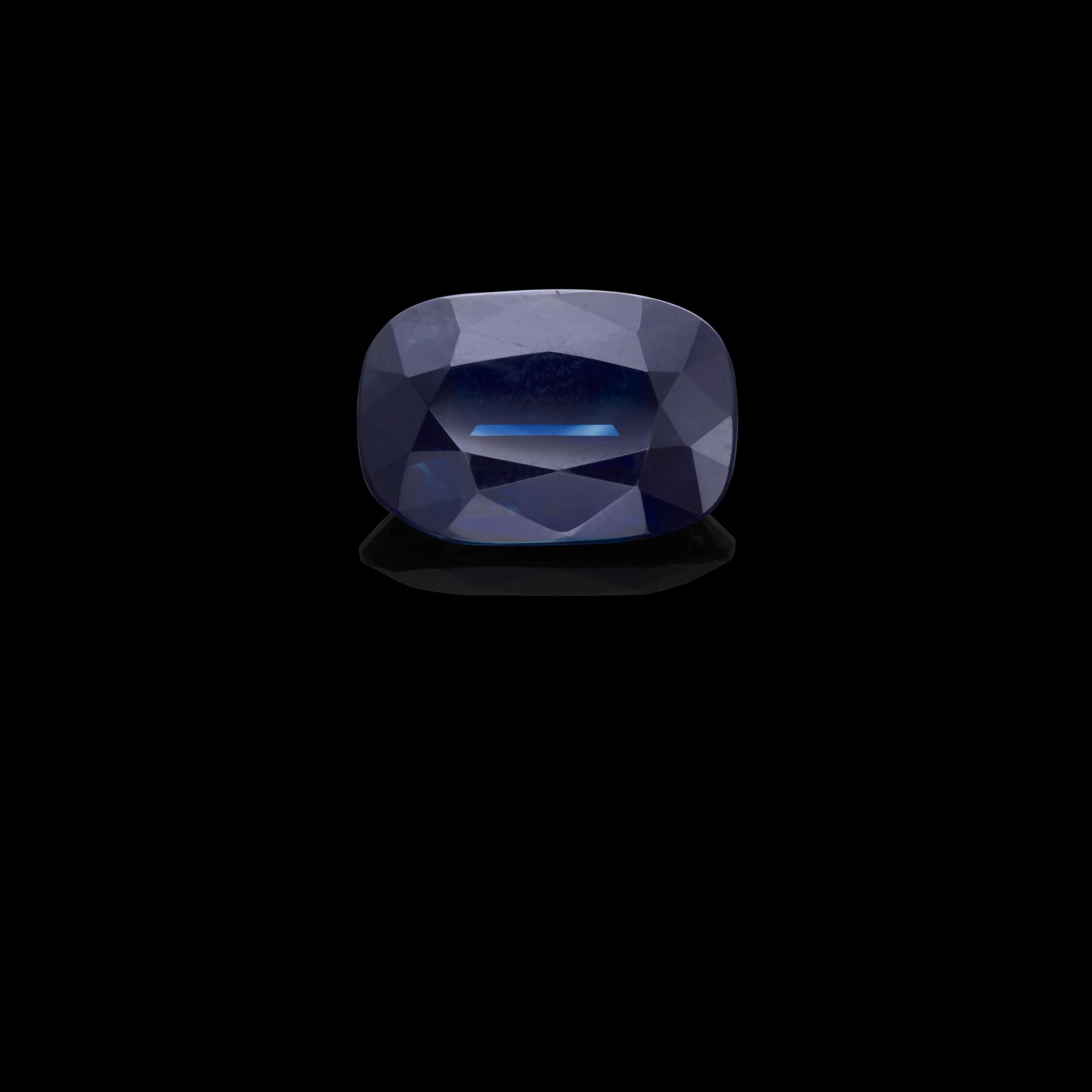 Appraisal: SAPPHIRE Australia A cushion-cut sapphire with deep greenish-blue hue suitable