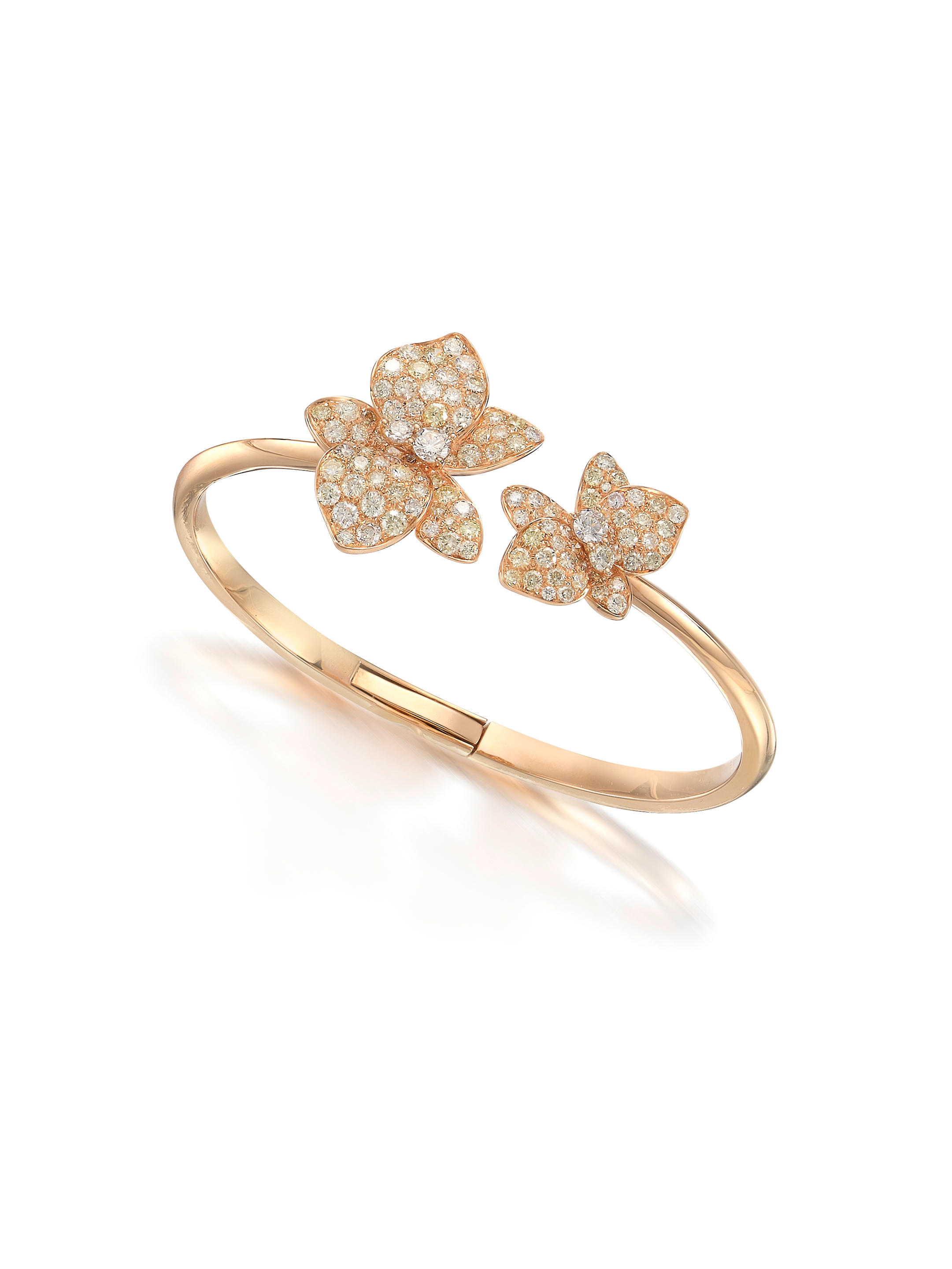 Appraisal: COLOURED DIAMOND AND DIAMOND 'FLOWER' BANGLE The hinged bangle designed