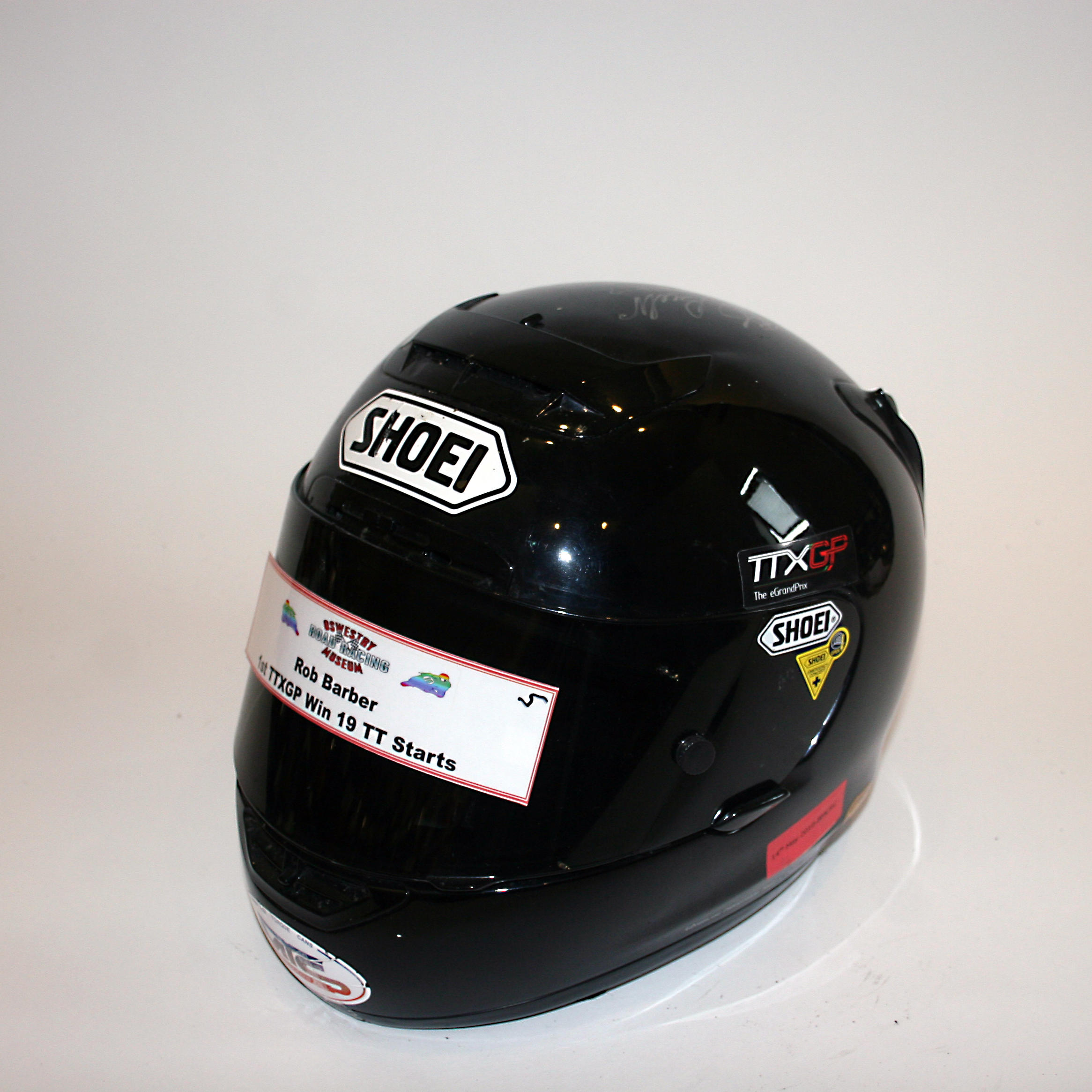 Appraisal: ROB BARBER A SIGNED X-SPIRIT FULL-FACE HELMET BY SHOEI used