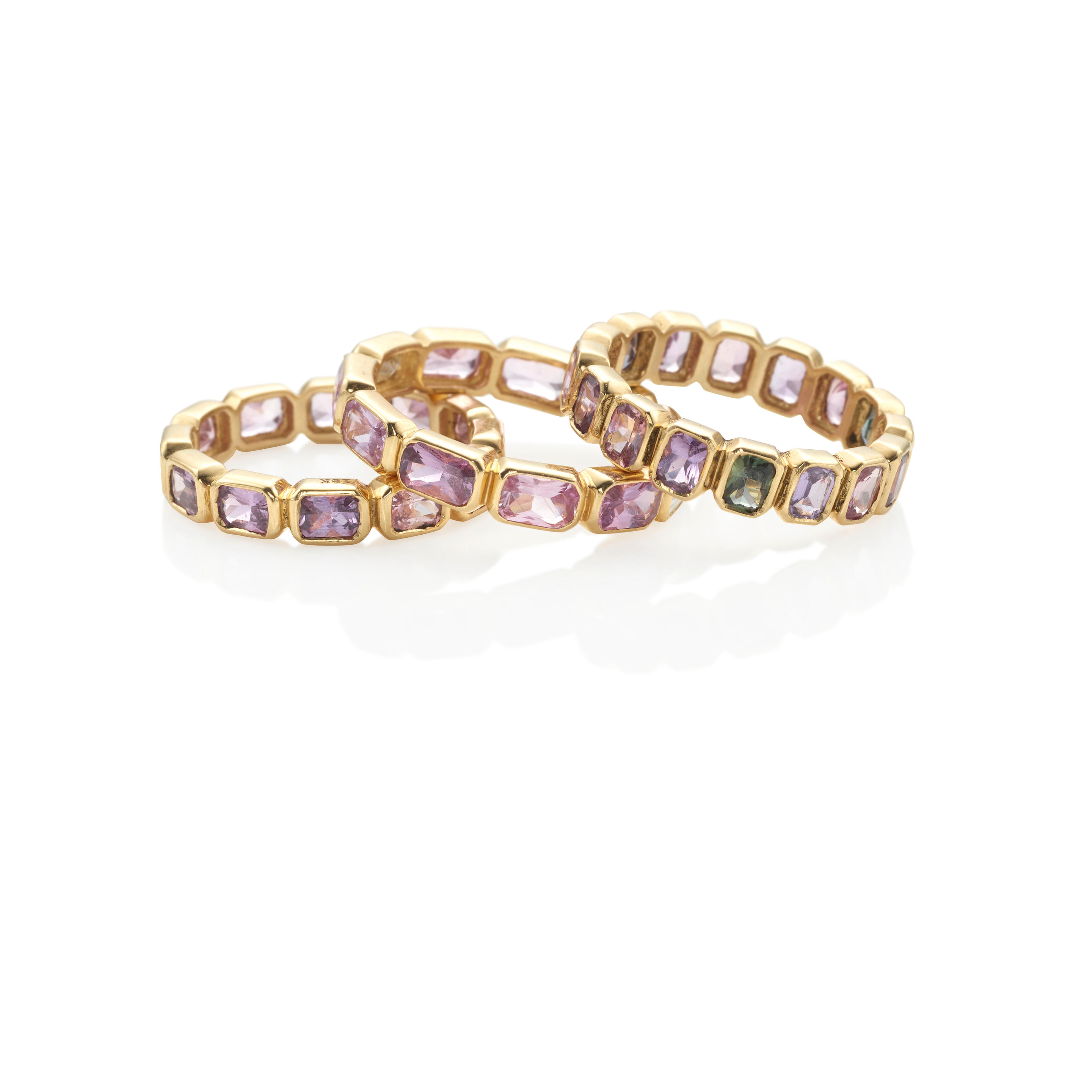 Appraisal: THREE K GOLD AND MULTI-SAPPHIRE RINGS Featuring cushion mixed-cut purple