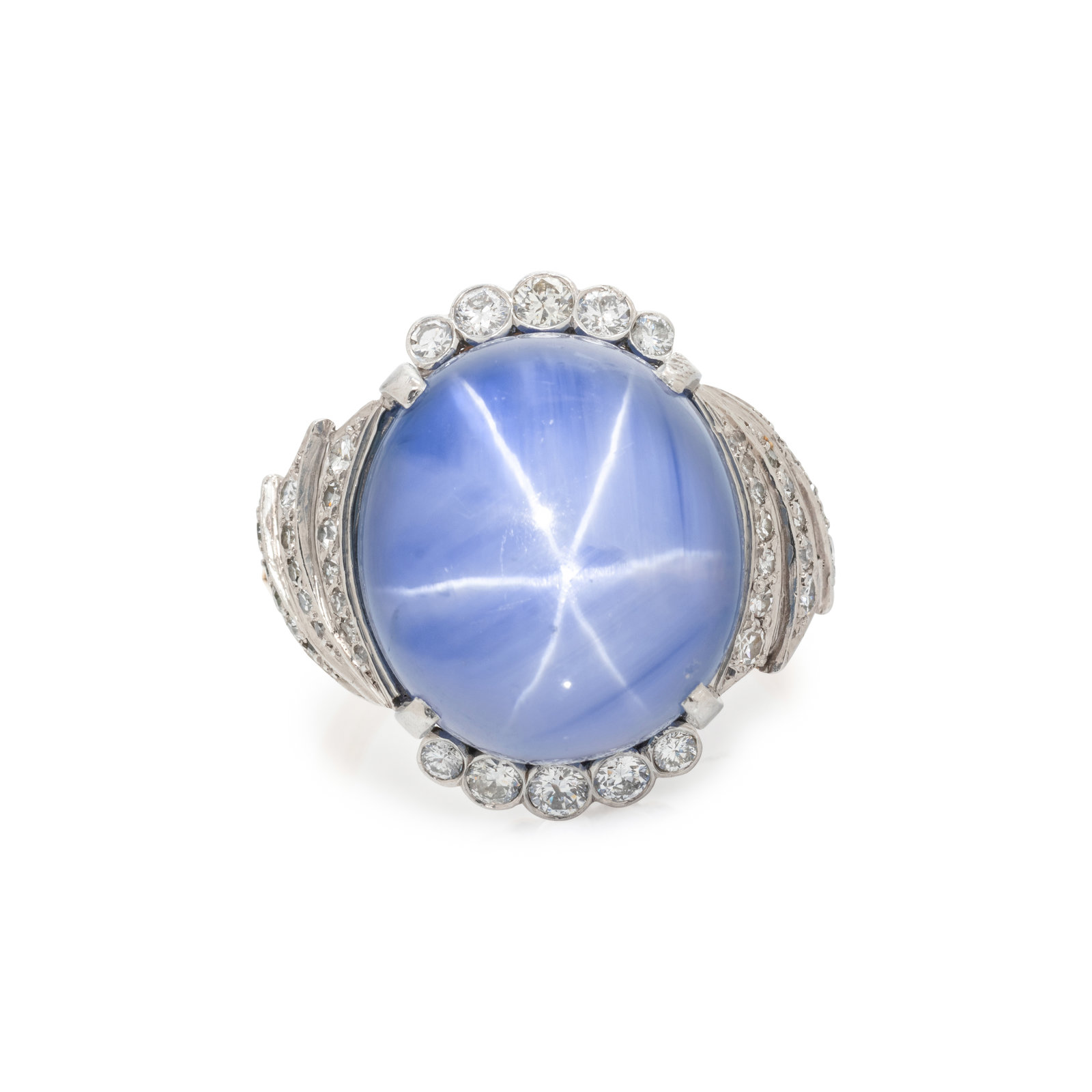 Appraisal: CEYLON STAR SAPPHIRE AND DIAMOND RING Containing one cabochon star