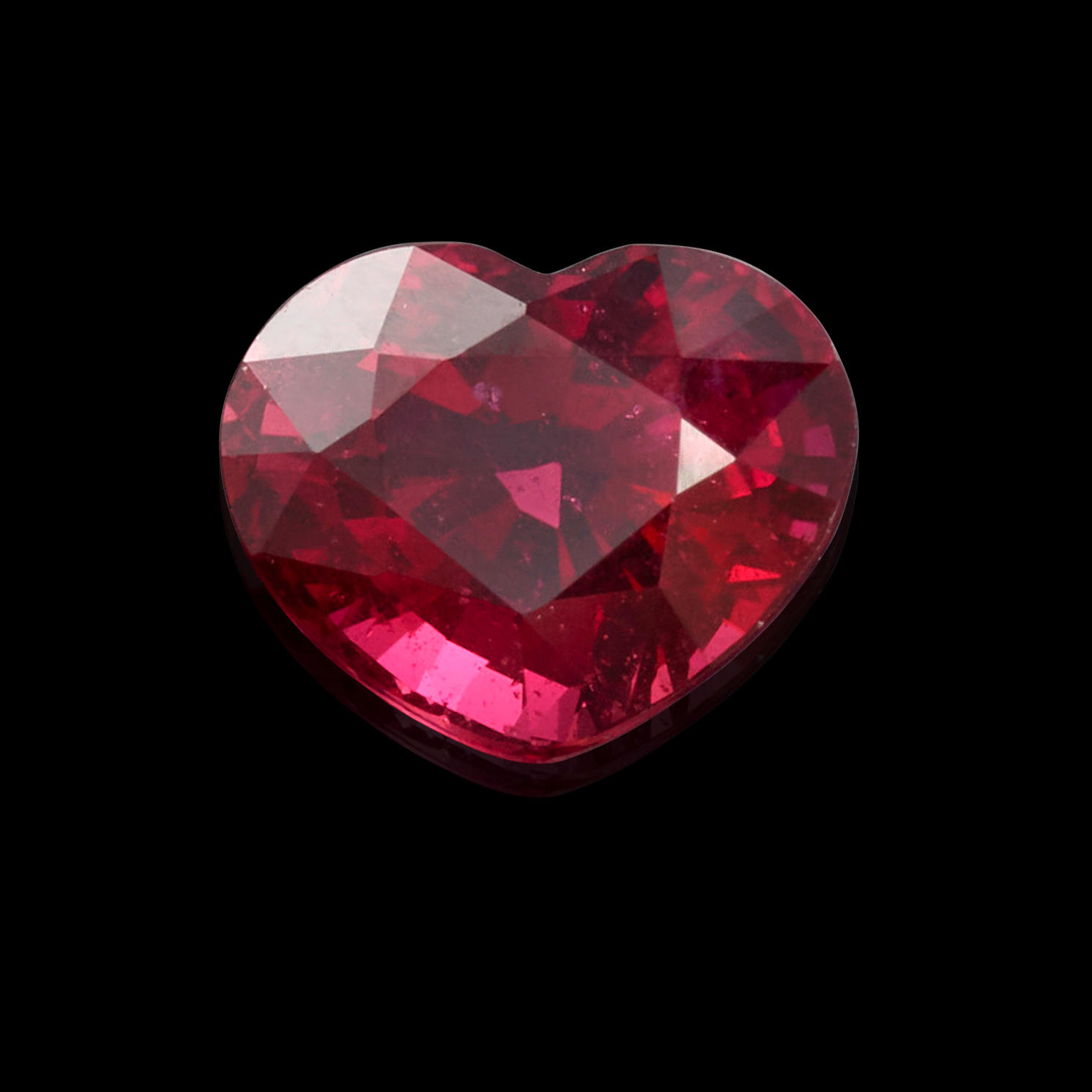 Appraisal: RUBY A heart-shaped ruby of strong red hue exhibiting great