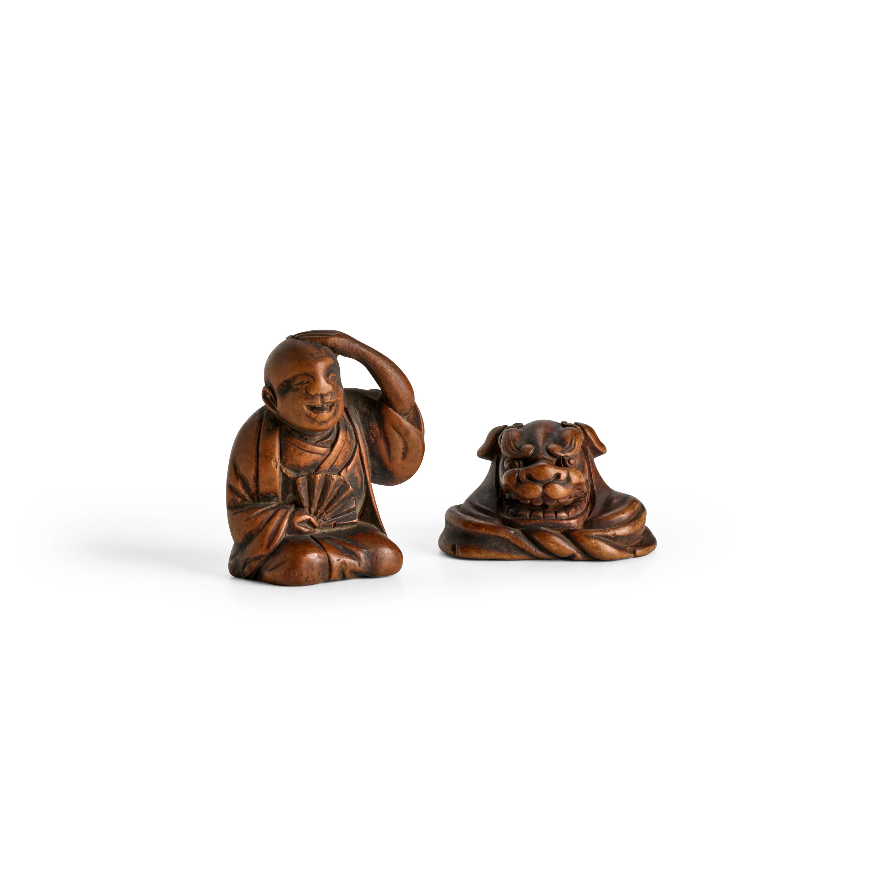 Appraisal: TWO WOOD NETSUKE Edo period - th century The first