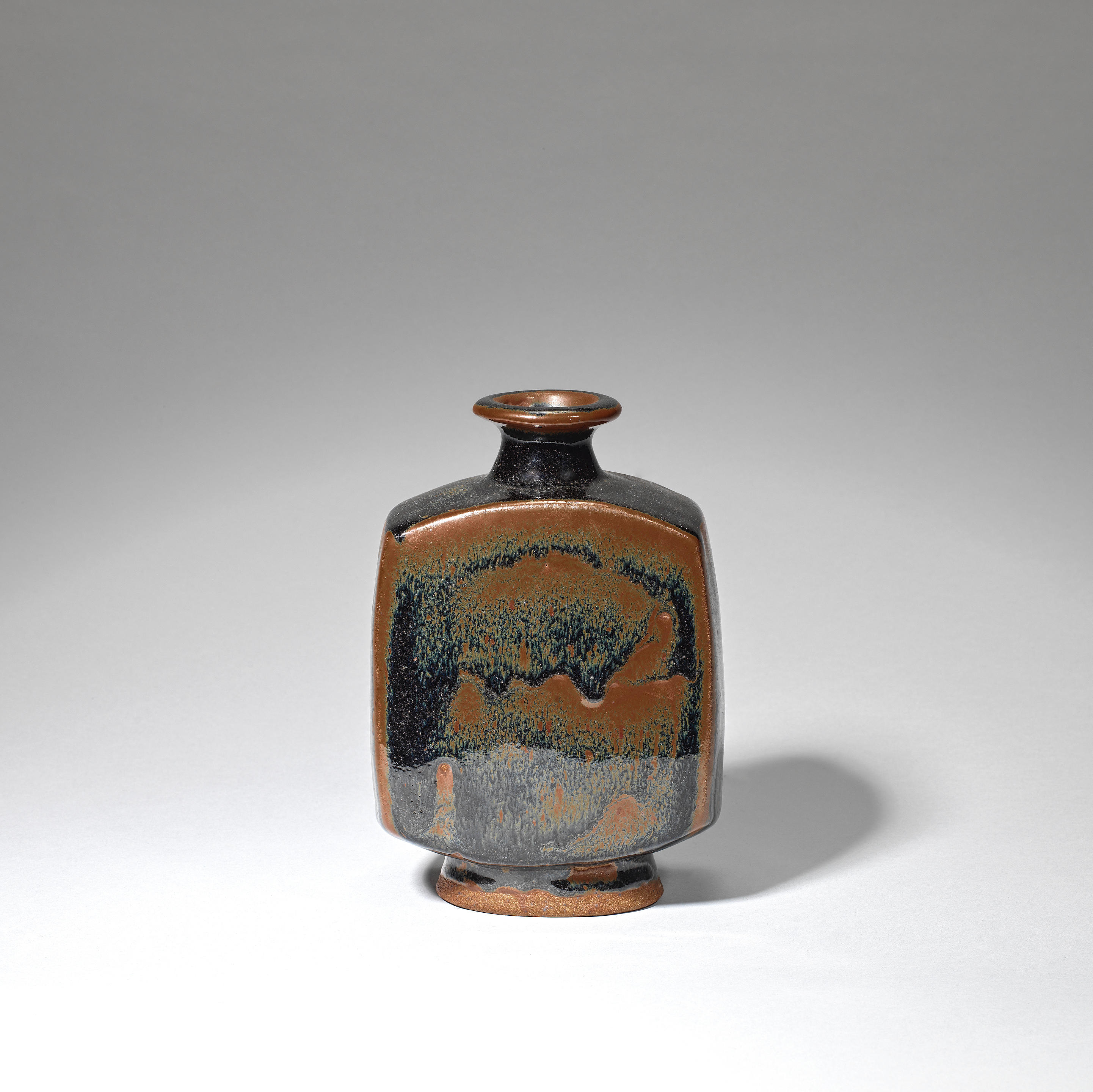 Appraisal: BERNARD LEACH Bottle vase circa Stoneware tenmoku and iron glazes