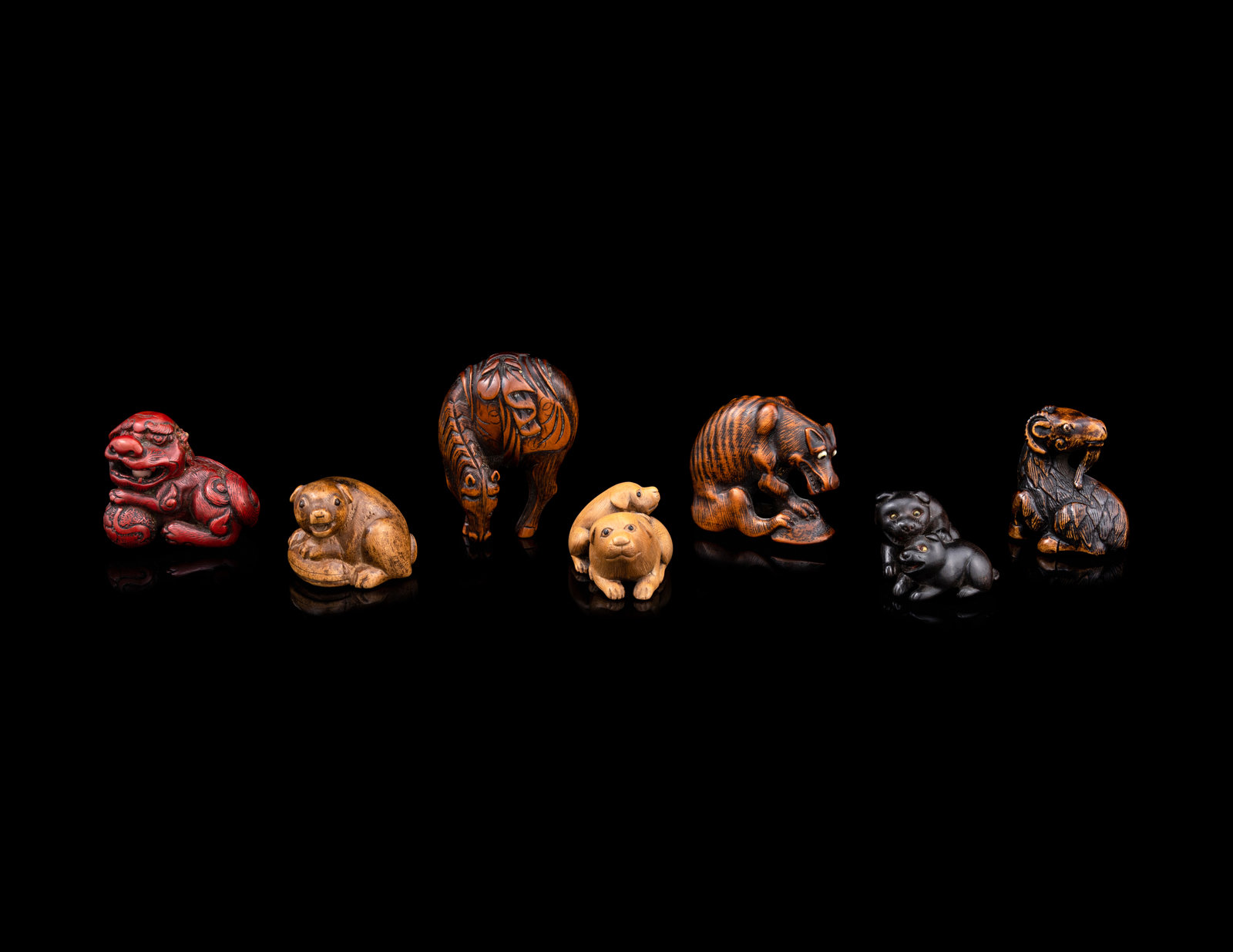 Appraisal: Seven Japanese Carved Wood Animal-Form Netsuke Late th- th Century