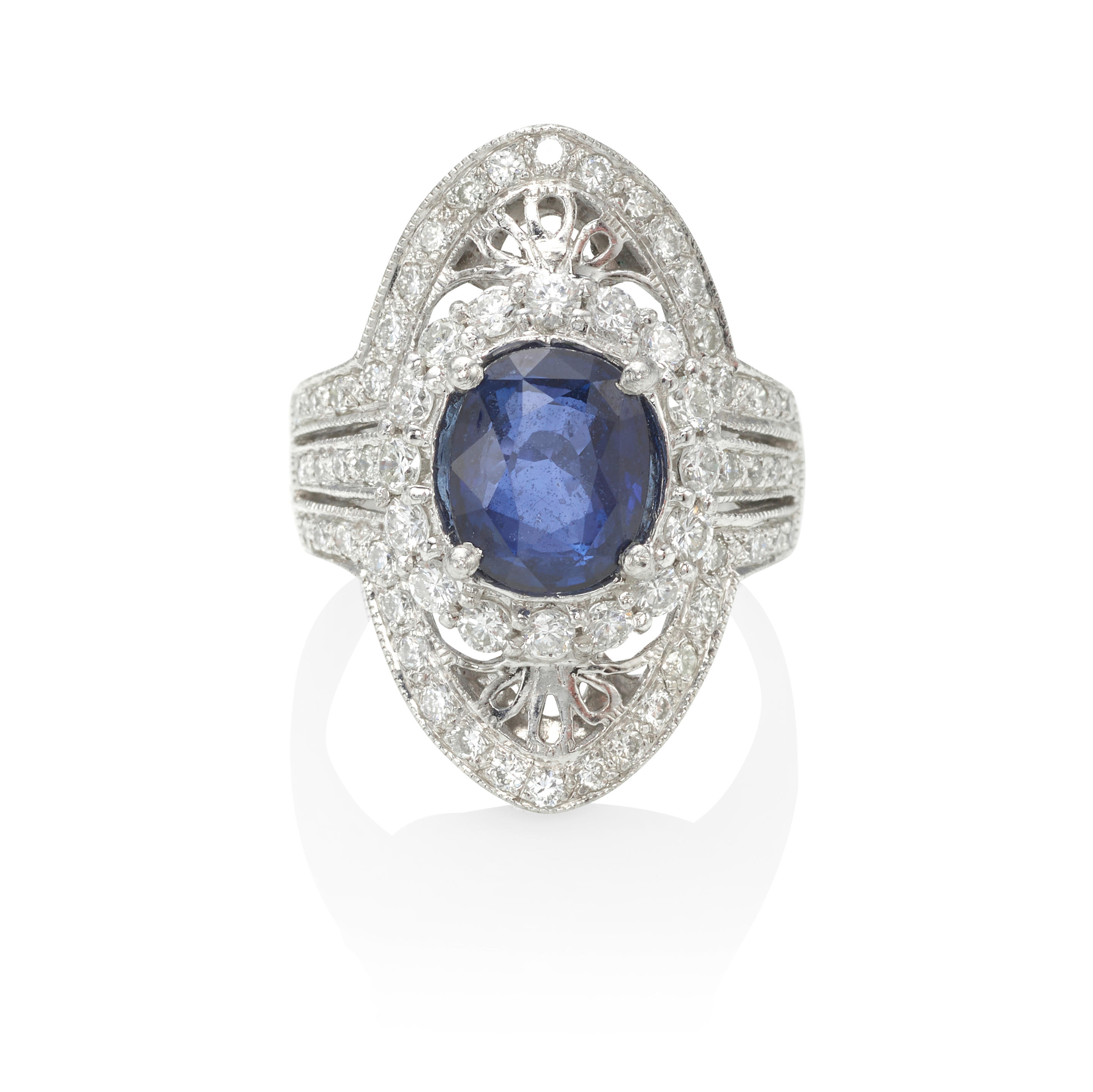 Appraisal: A PLATINUM SAPPHIRE AND DIAMOND RING Platinum oval sapphire x