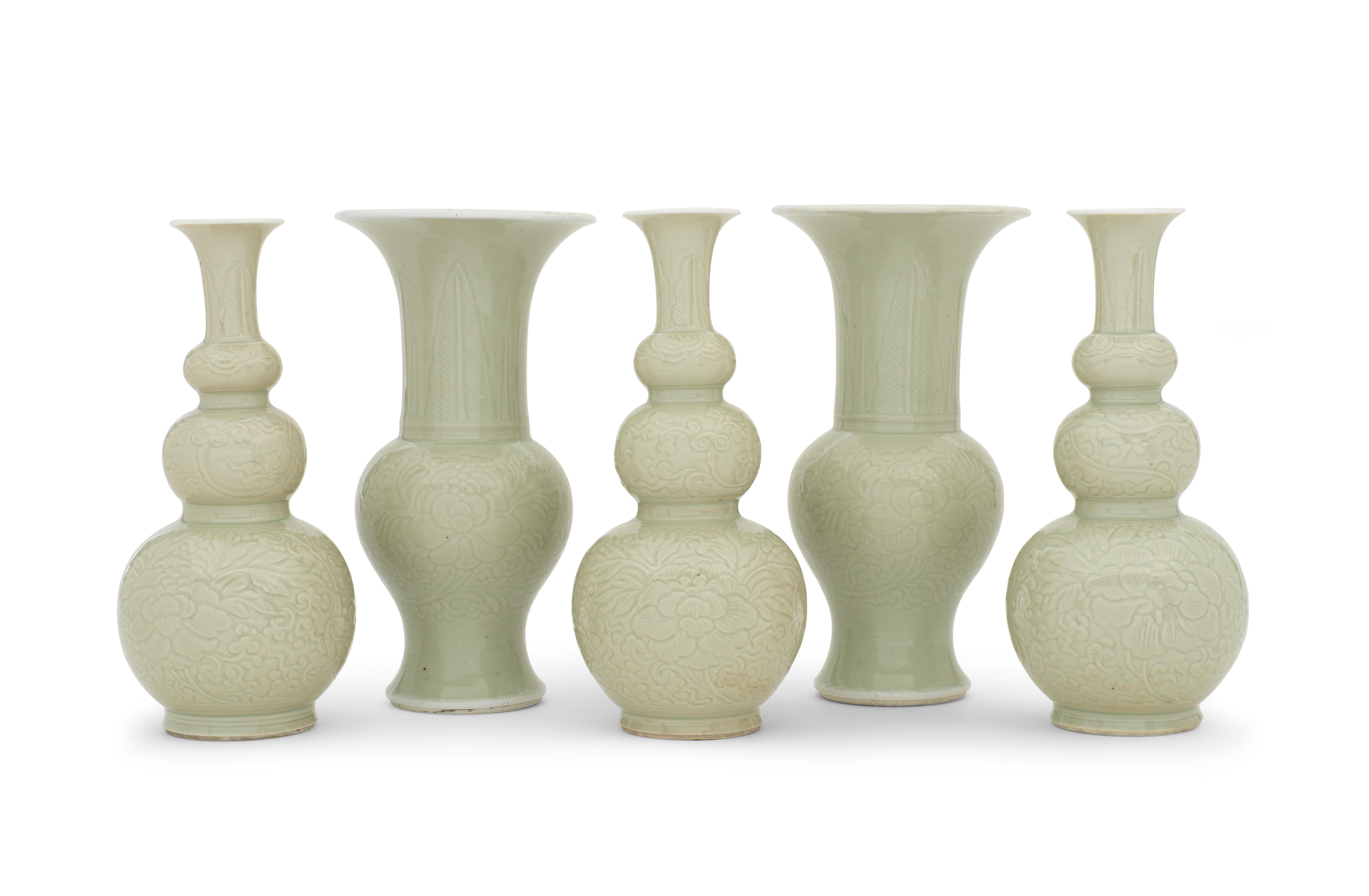 Appraisal: A RARE GARNITURE OF FIVE INCISED CELADON-GLAZED VASES Kangxi Comprising