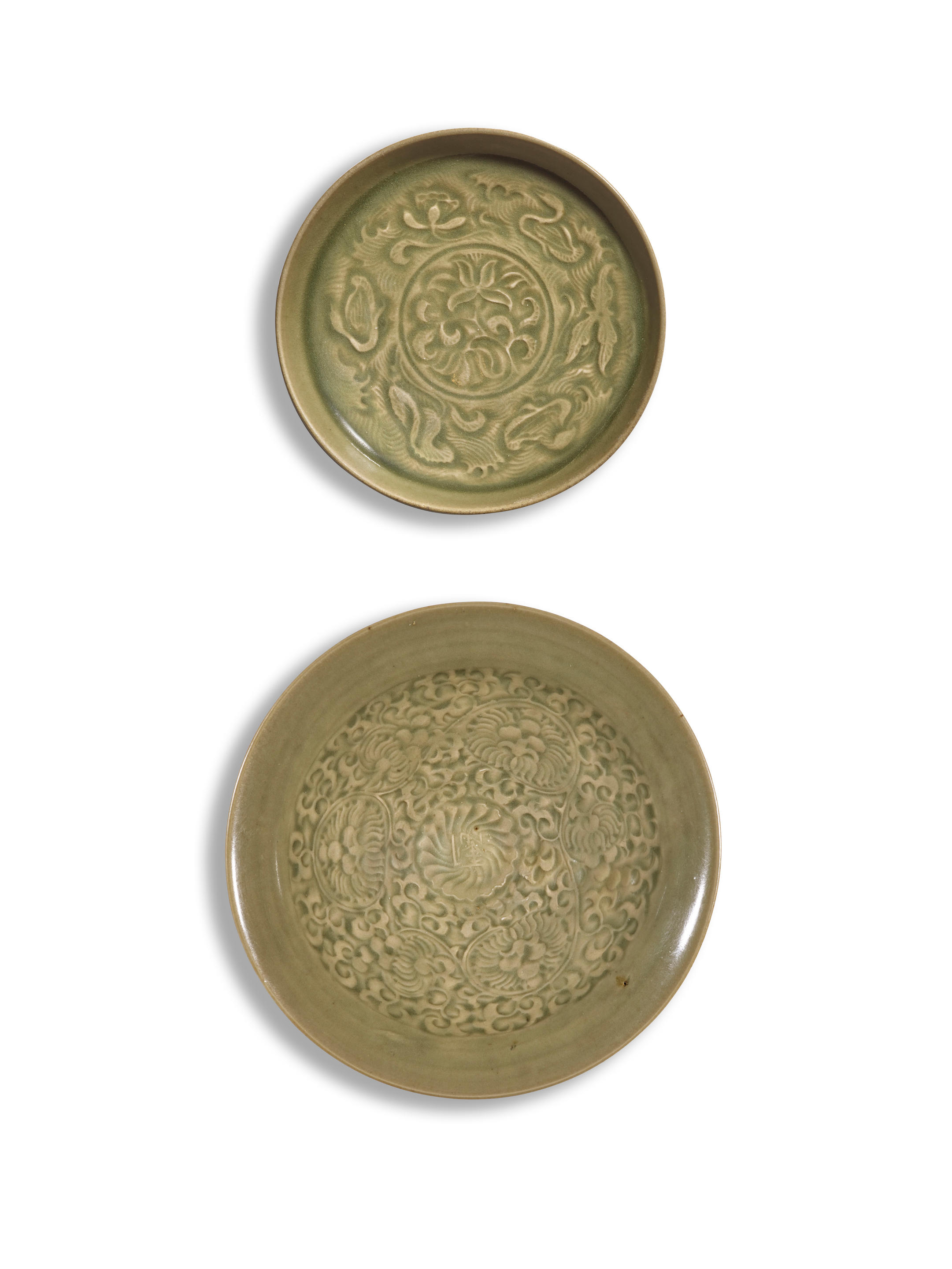 Appraisal: A YAOZHOU 'CHRYSANTHEMUM' BOWL AND A YAOZHOU 'FLORAL' DISH Song