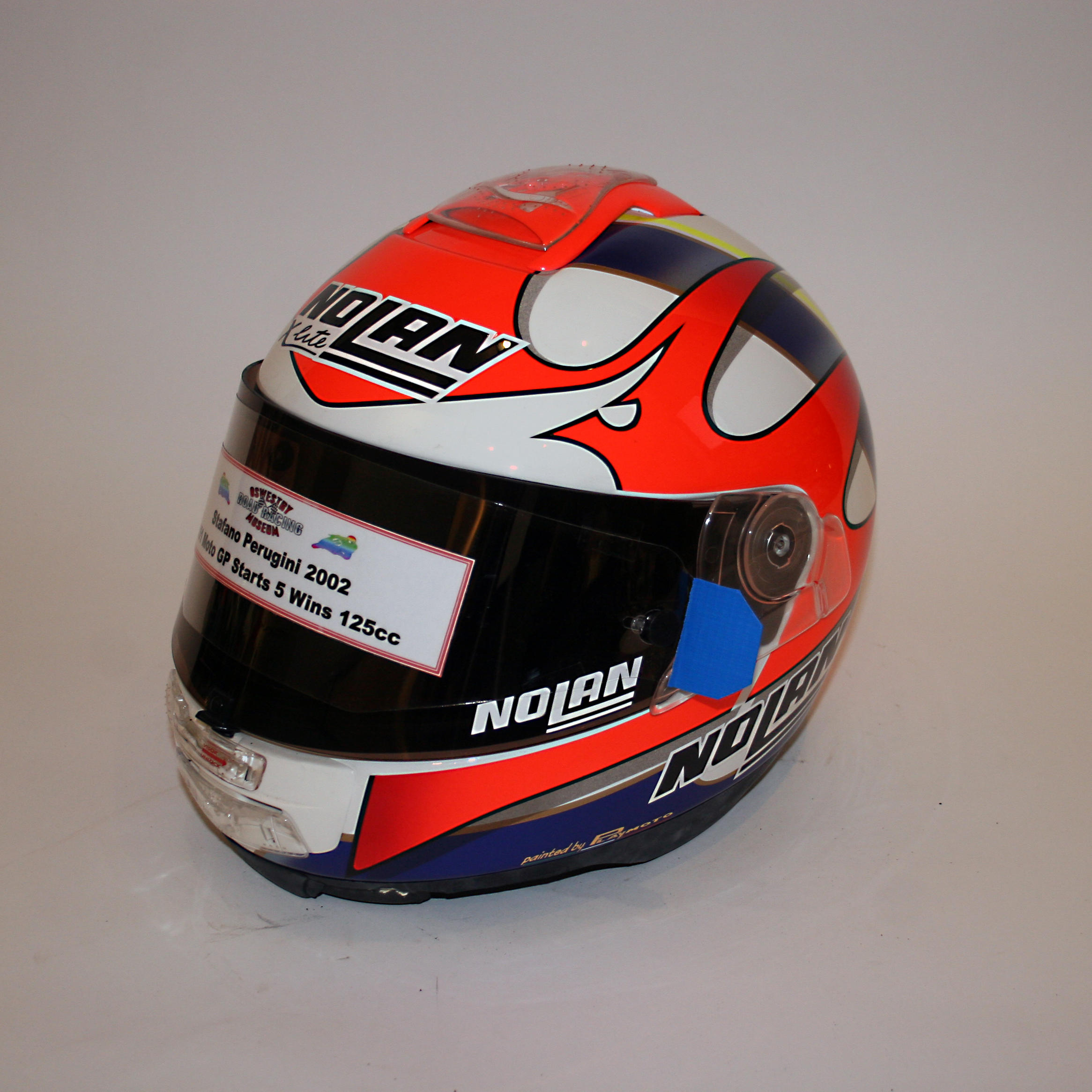 Appraisal: STEFANO PERUGINI AN X-LITE FULL-FACE HELMET BY NOLAN used and