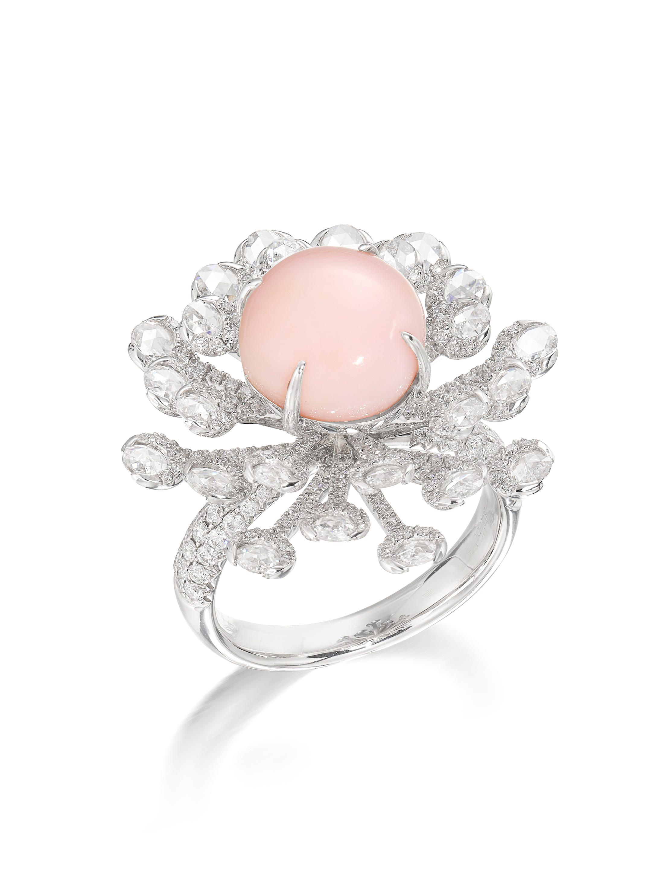 Appraisal: CONCH PEARL AND DIAMOND RING Centring on a cabochon conch