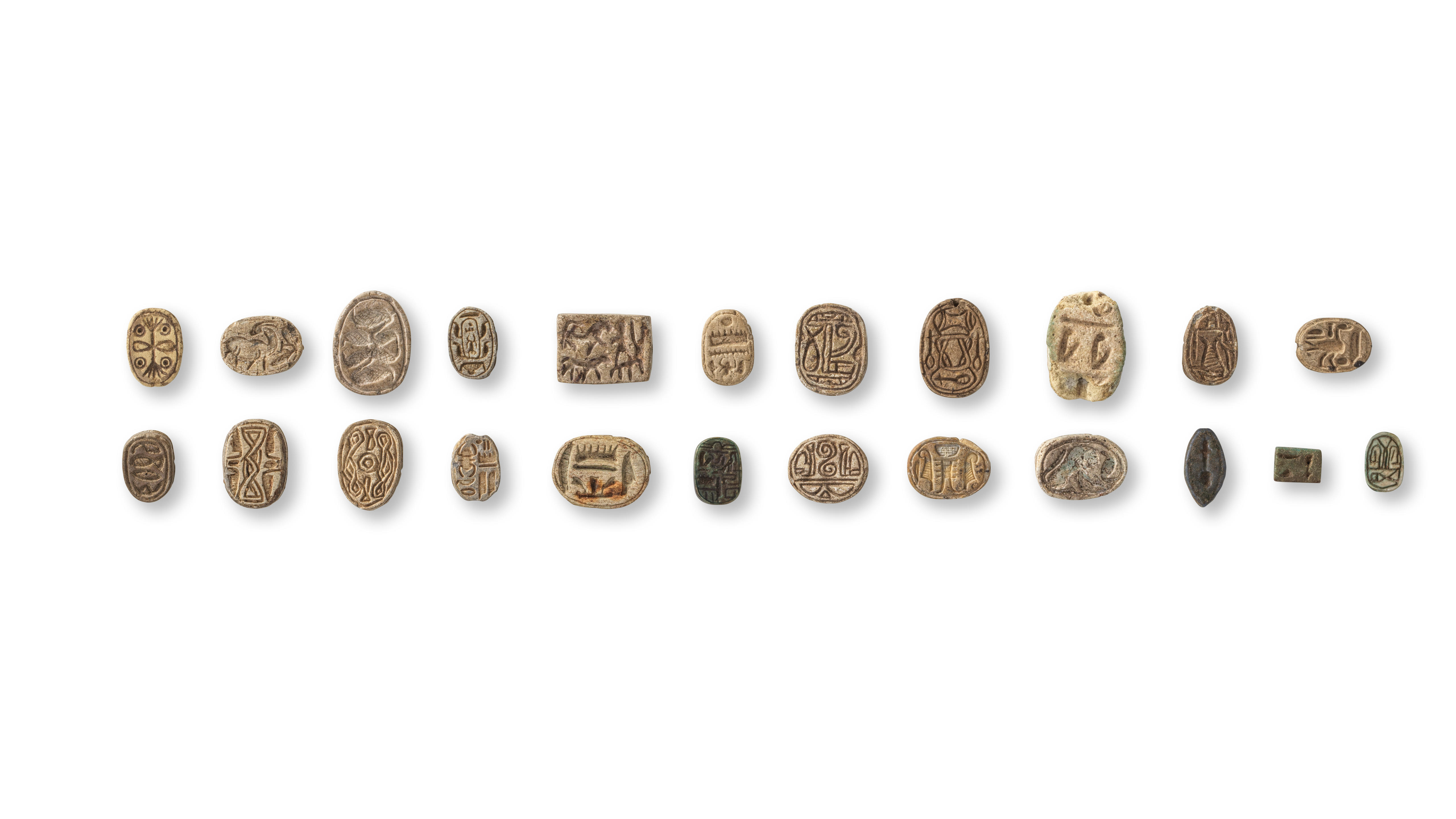 Appraisal: A GROUP OF EGYPTIAN STEATITE SCARABS PLAQUES AND SCARABOIDS A