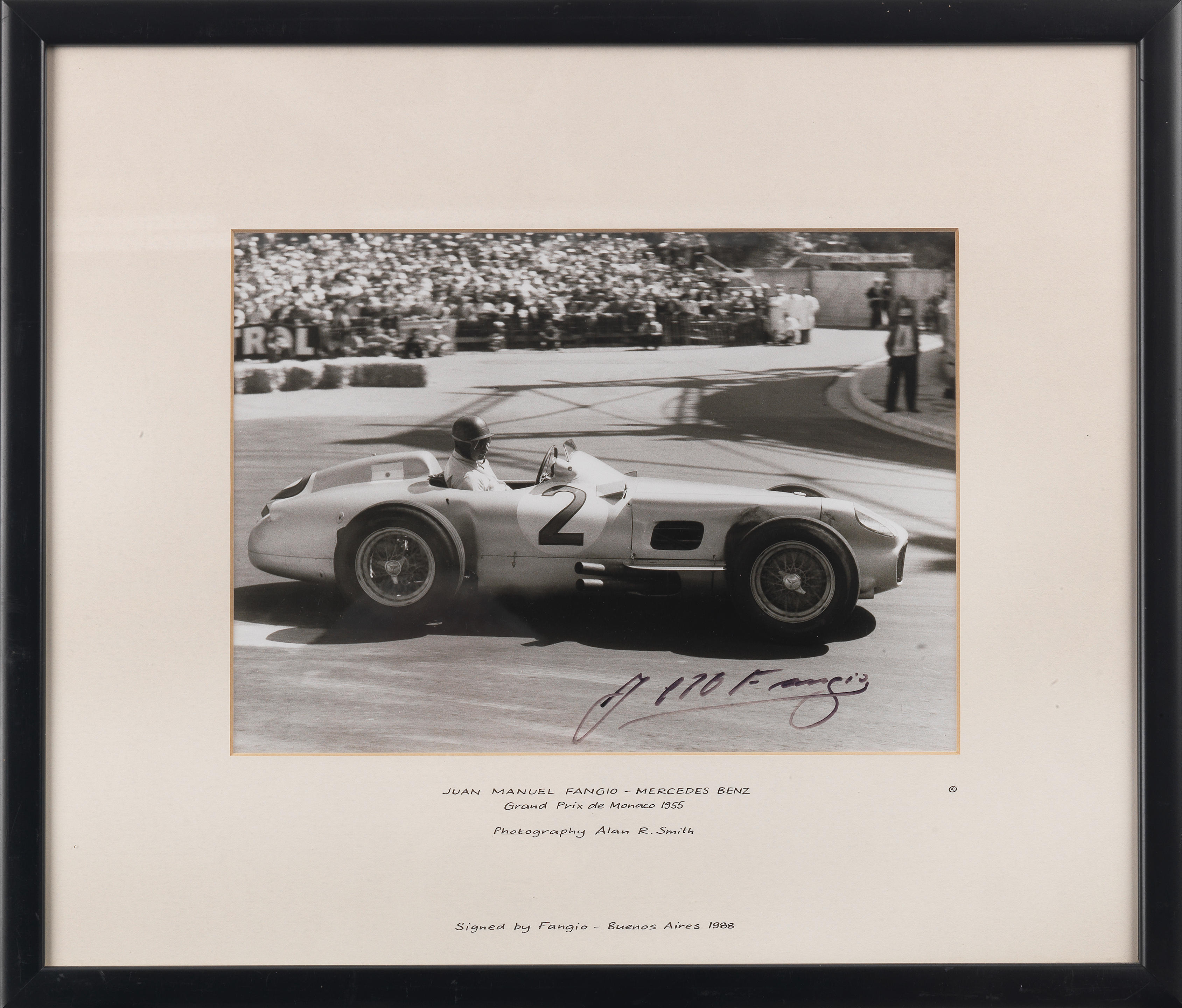 Appraisal: A FRAMED SIGNED PHOTOGRAPH OF JUAN MANUEL FANGIO IN THE