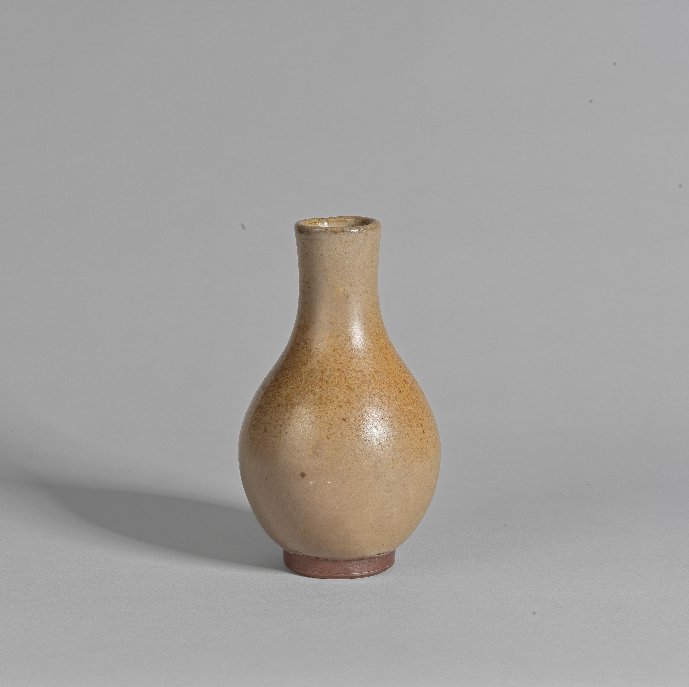 Appraisal: BERNARD LEACH Bottle vase Stoneware mottled brown ash glaze with