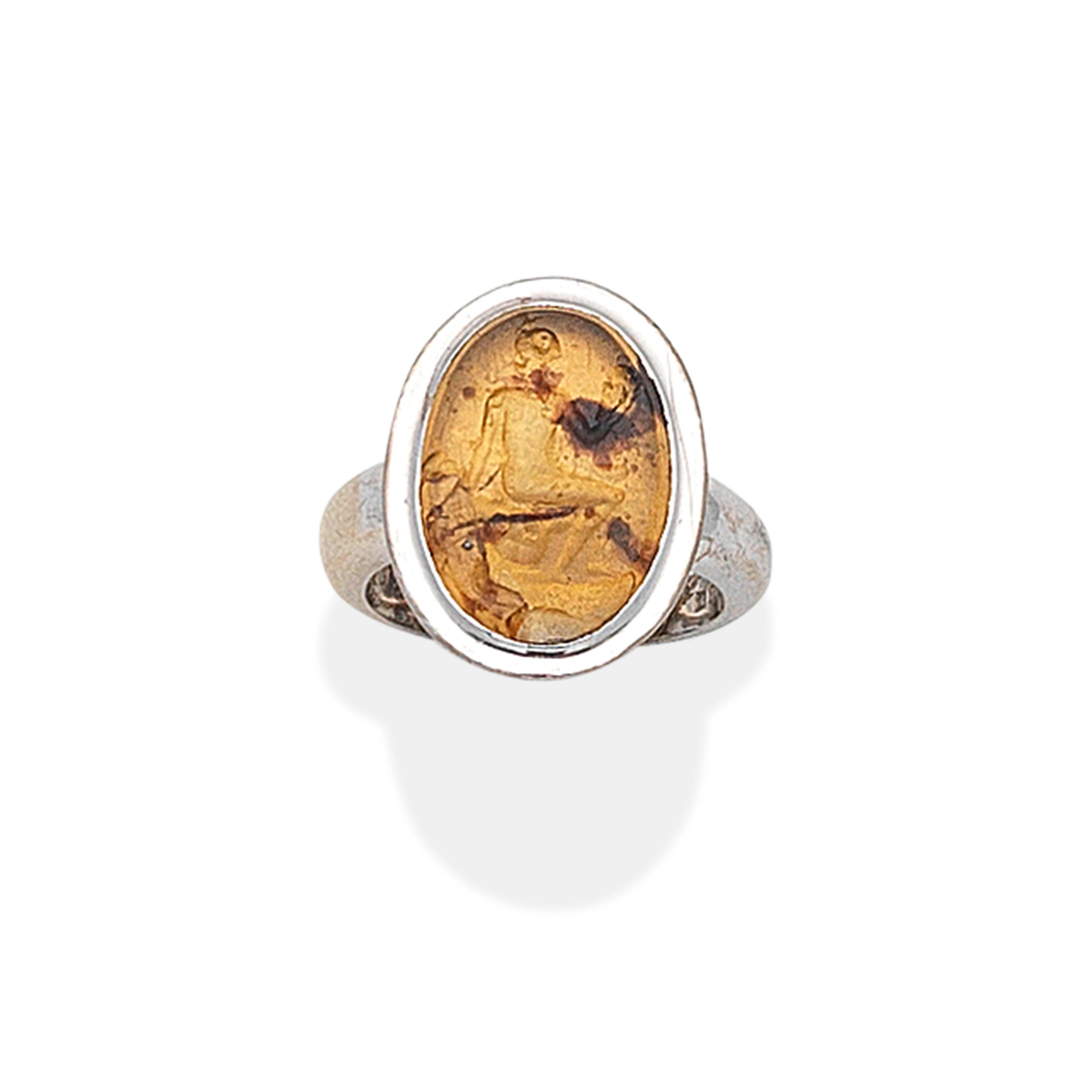 Appraisal: MOUNTED BY CARTIER INTAGLIO RING The amber intaglio carved to