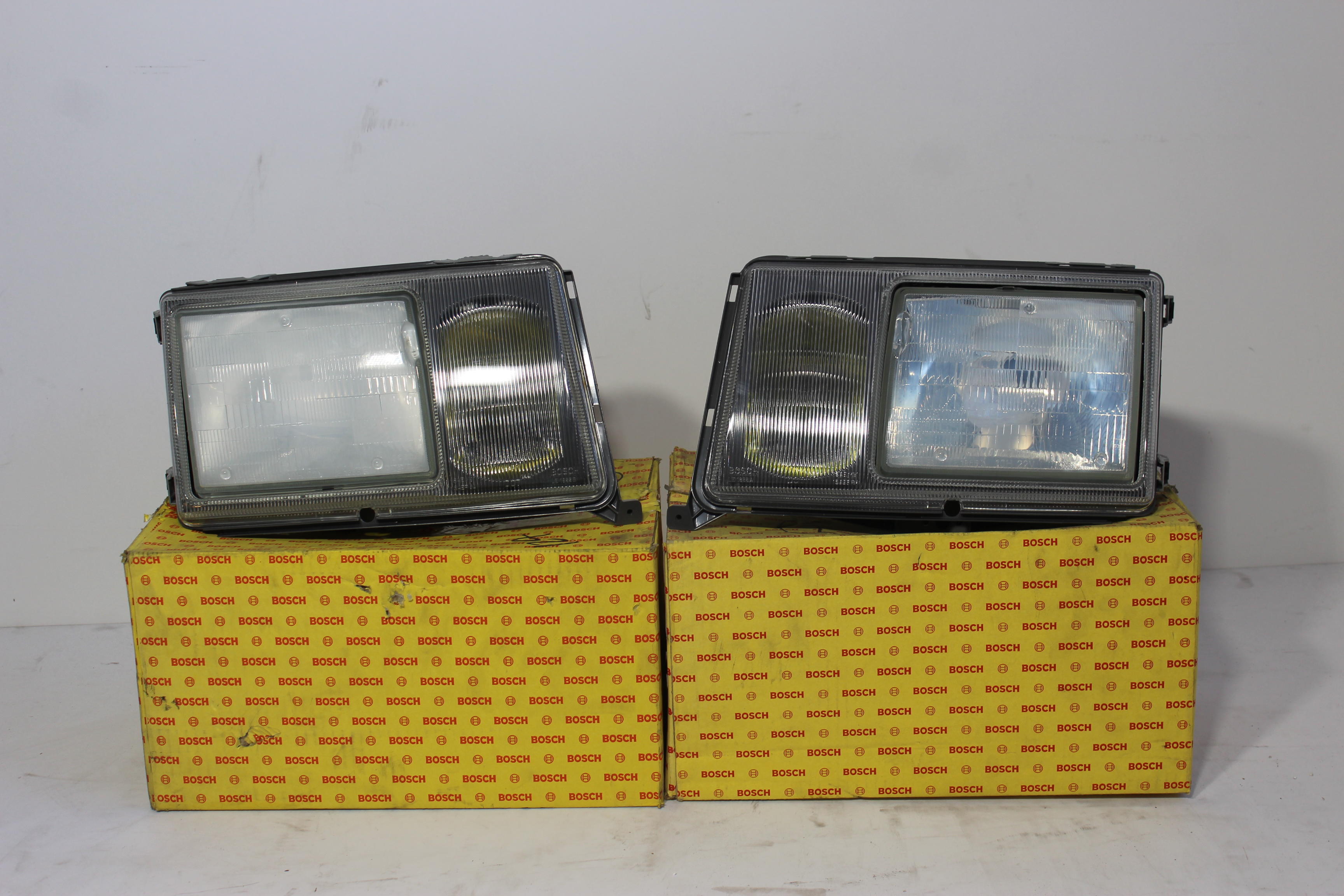 Appraisal: A PAIR OF NOS U S SPEC BOSCH HEADLIGHTS FOR