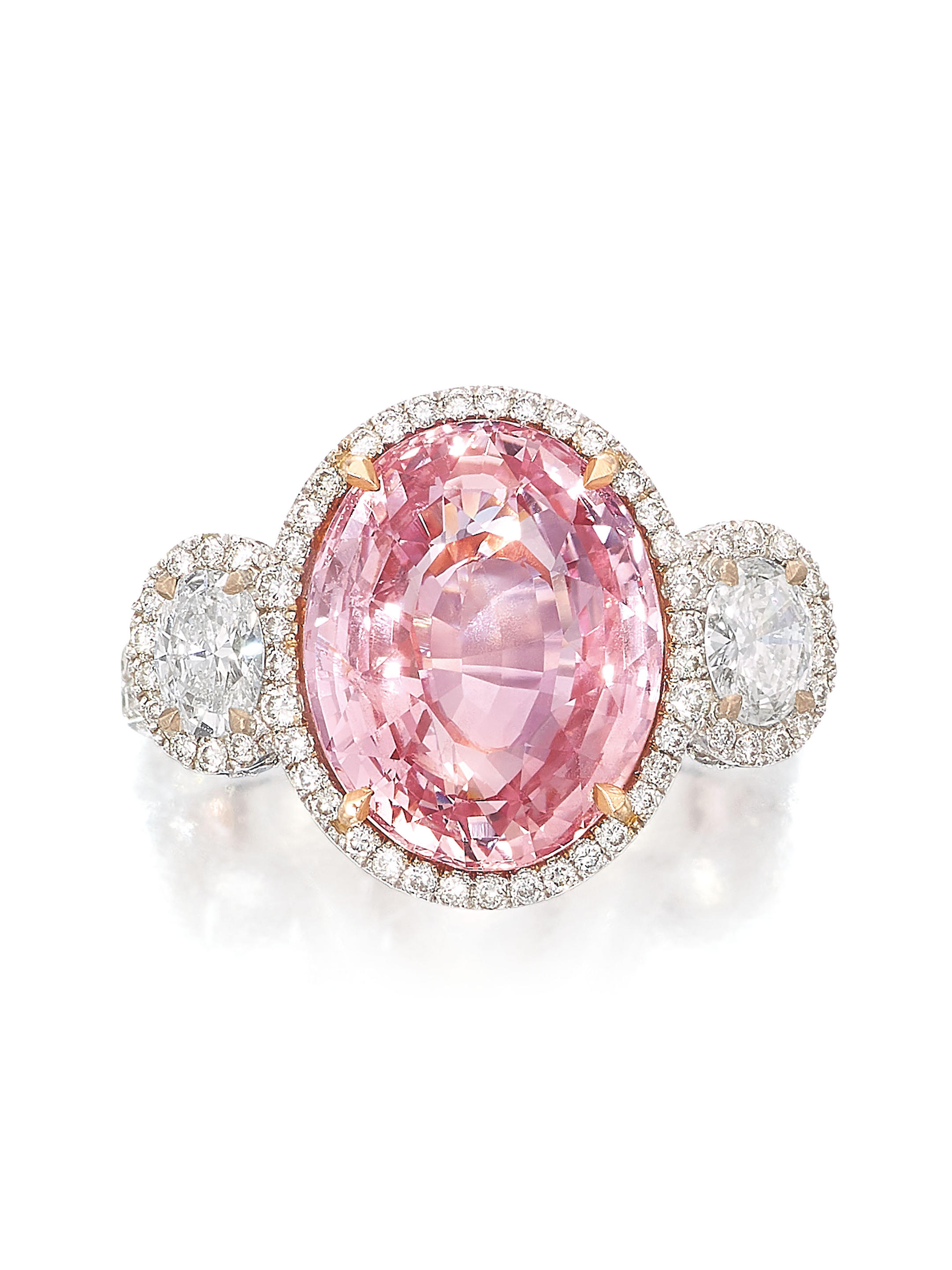 Appraisal: PADPARADSCHA SAPPHIRE AND DIAMOND RING The oval padparadscha sapphire weighing