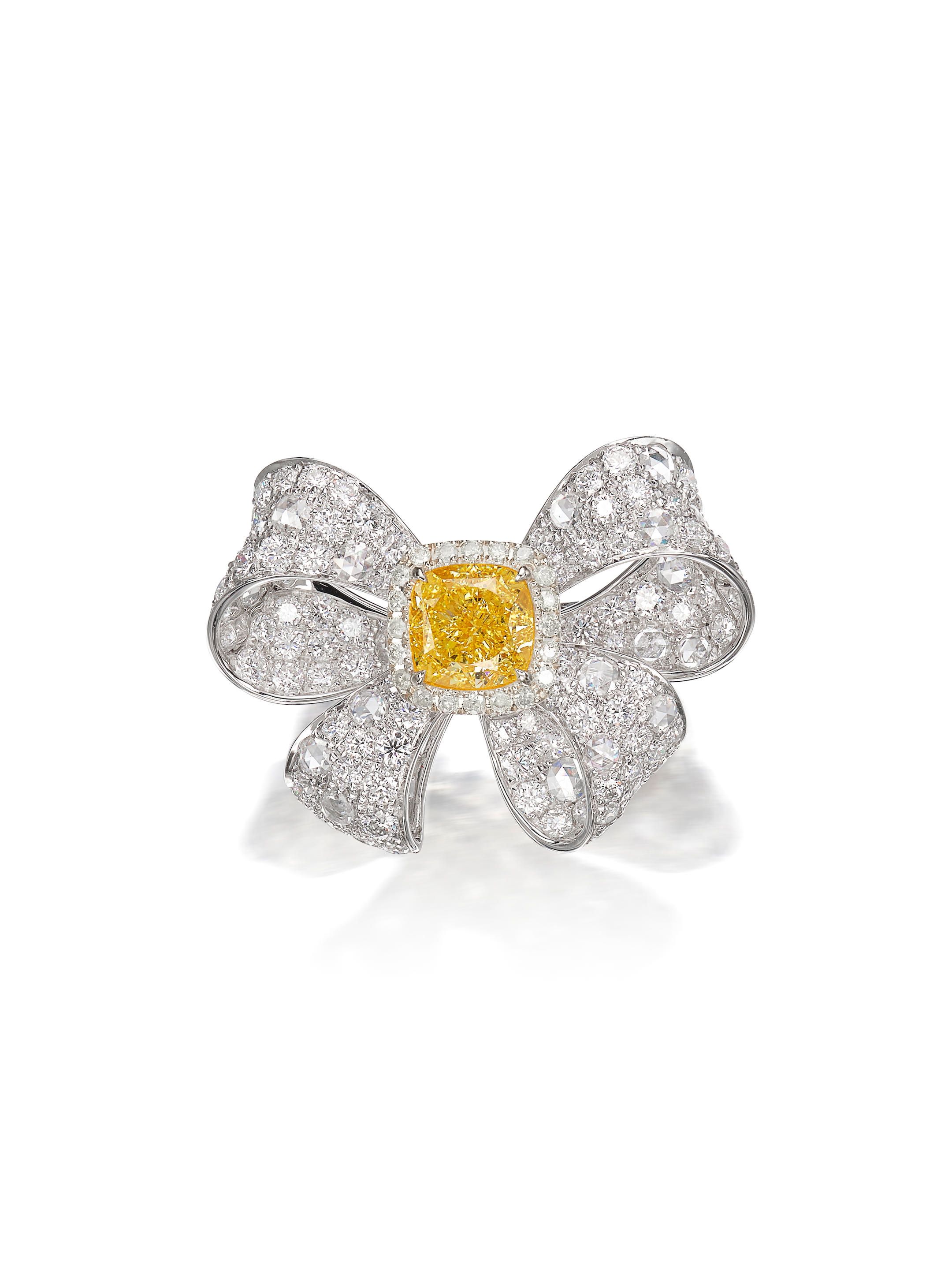 Appraisal: FANCY INTENSE YELLOW DIAMOND AND DIAMOND 'RIBBON' RING Of ribbon