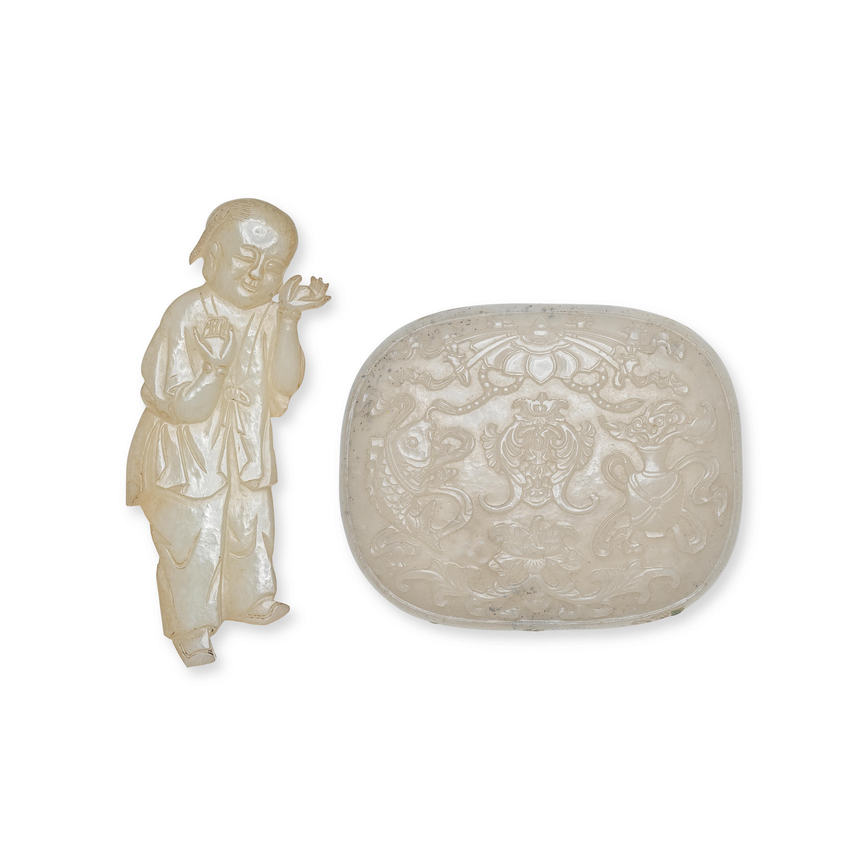 Appraisal: A PALE CELADON JADE 'BOY' PLAQUE AND AN OVAL 'BUDDHIST