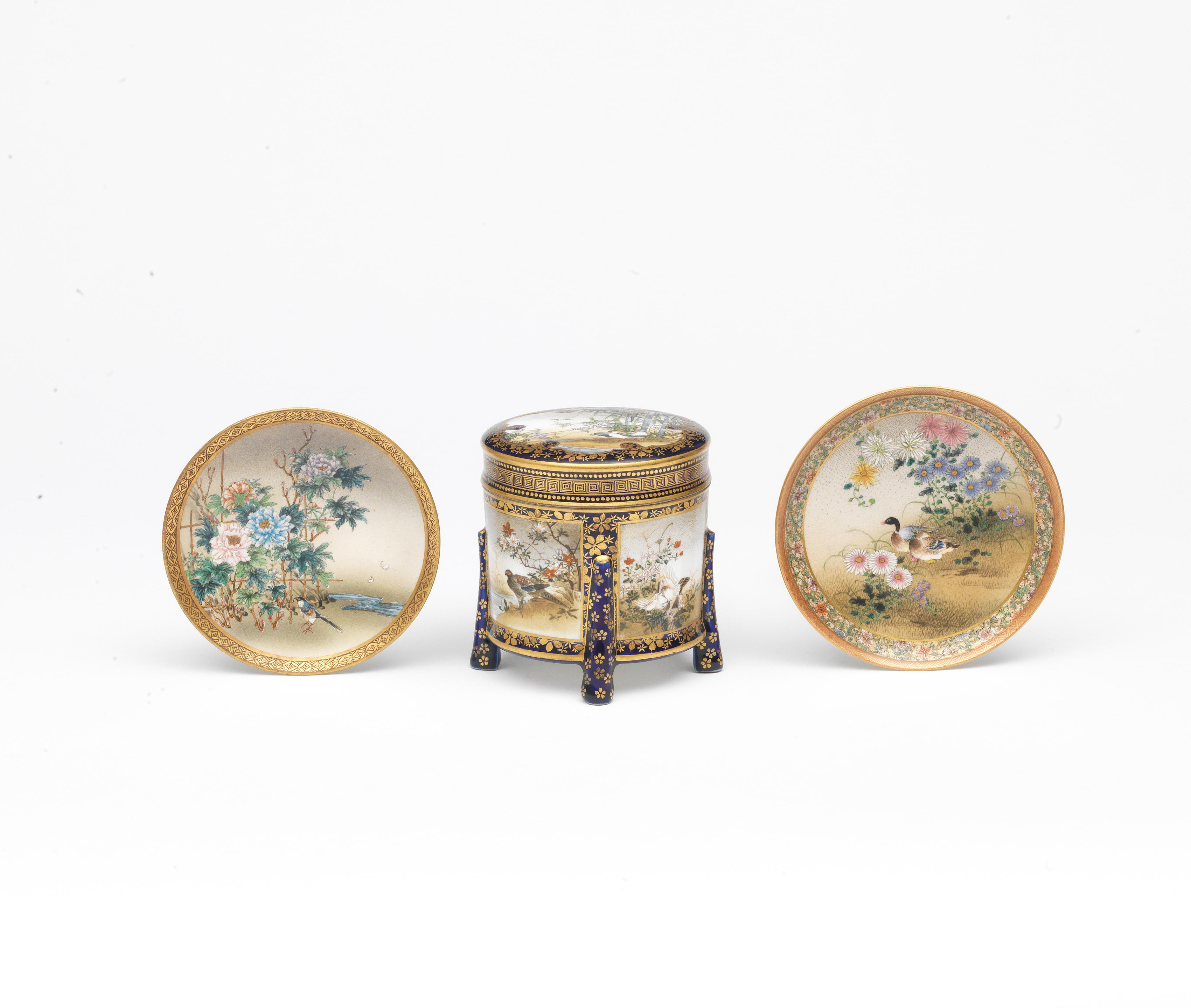 Appraisal: TWO SATSUMA SAUCER DISHES AND A CYLINDRICAL KARABITSU STORAGE BOX