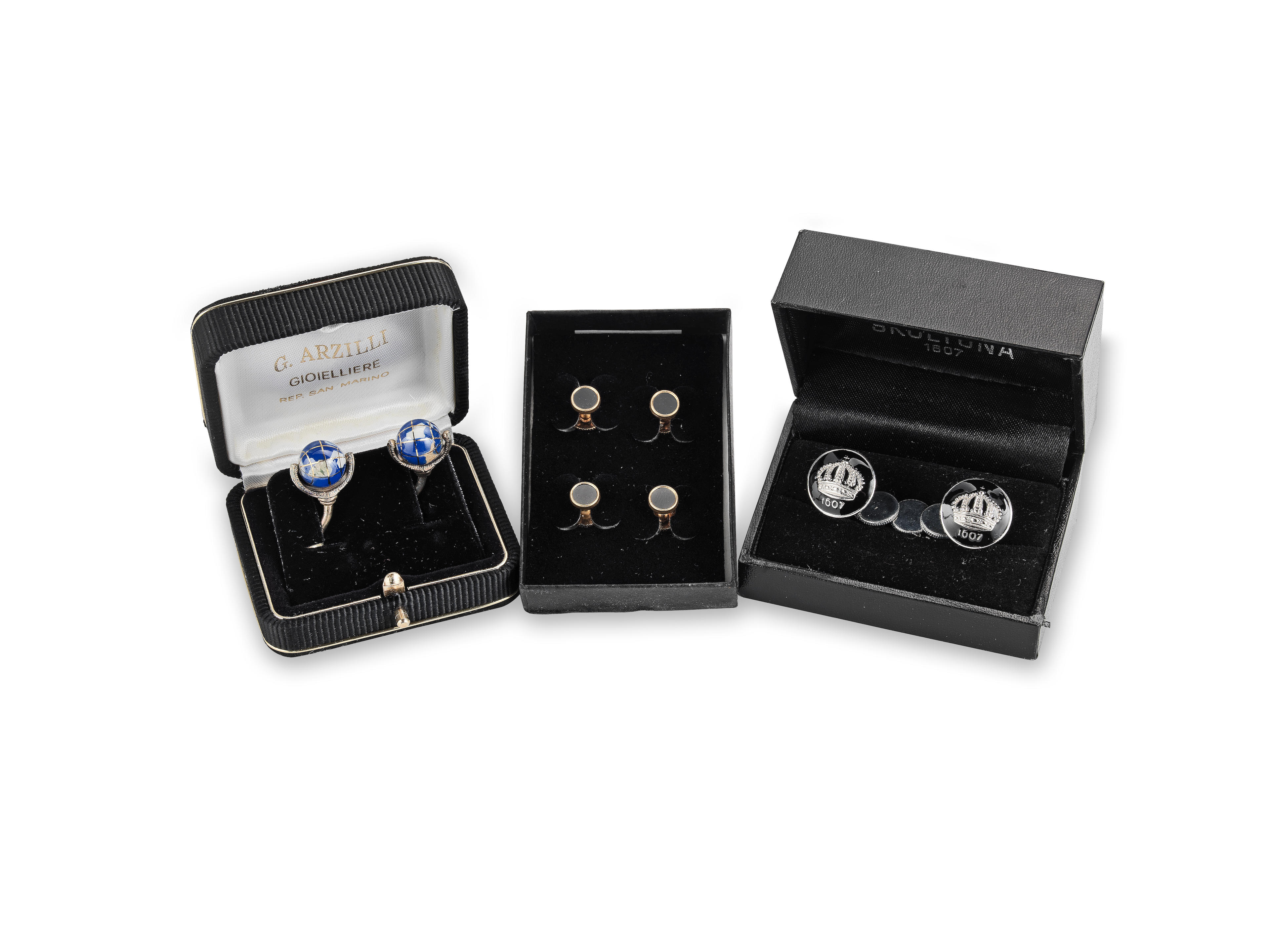 Appraisal: TWO PAIRS OF SIR ROGER MOORE'S CUFFLINKS One pair with