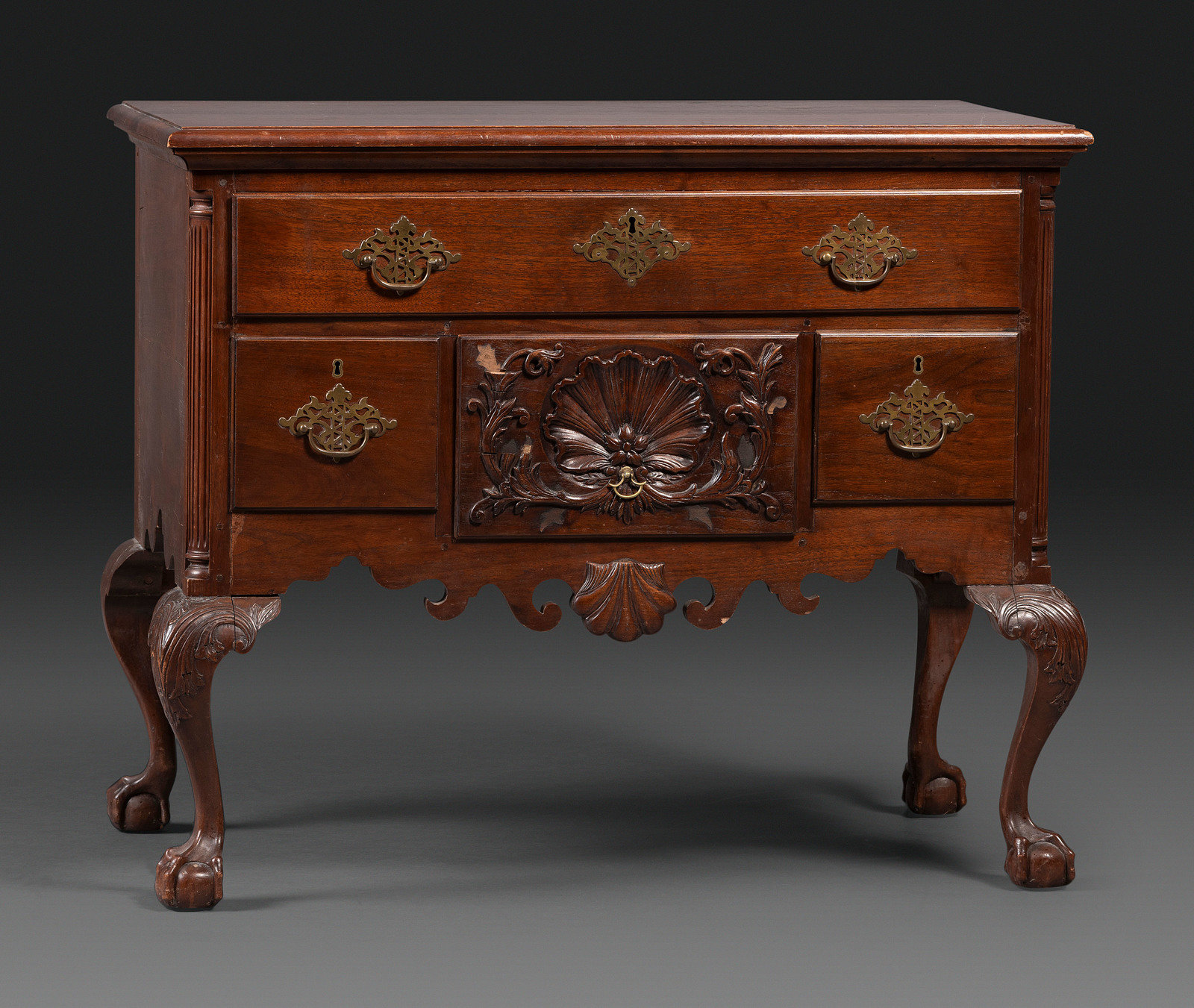 Appraisal: A Chippendale Style Shell Carved Mahogany Claw-and-Ball Foot Dressing Table