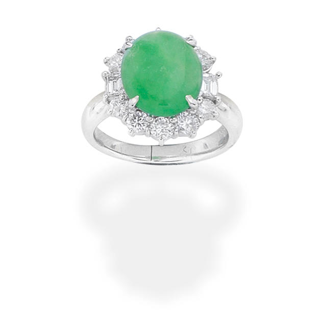 Appraisal: JADE AND DIAMOND RING The oval jadeite jade cabochon within