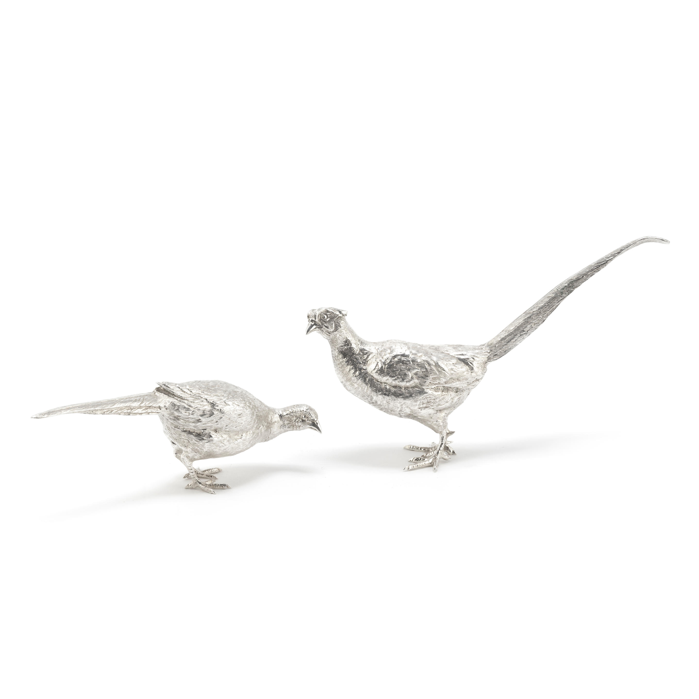 Appraisal: A PAIR OF SILVER PHEASANTS B S E Products London